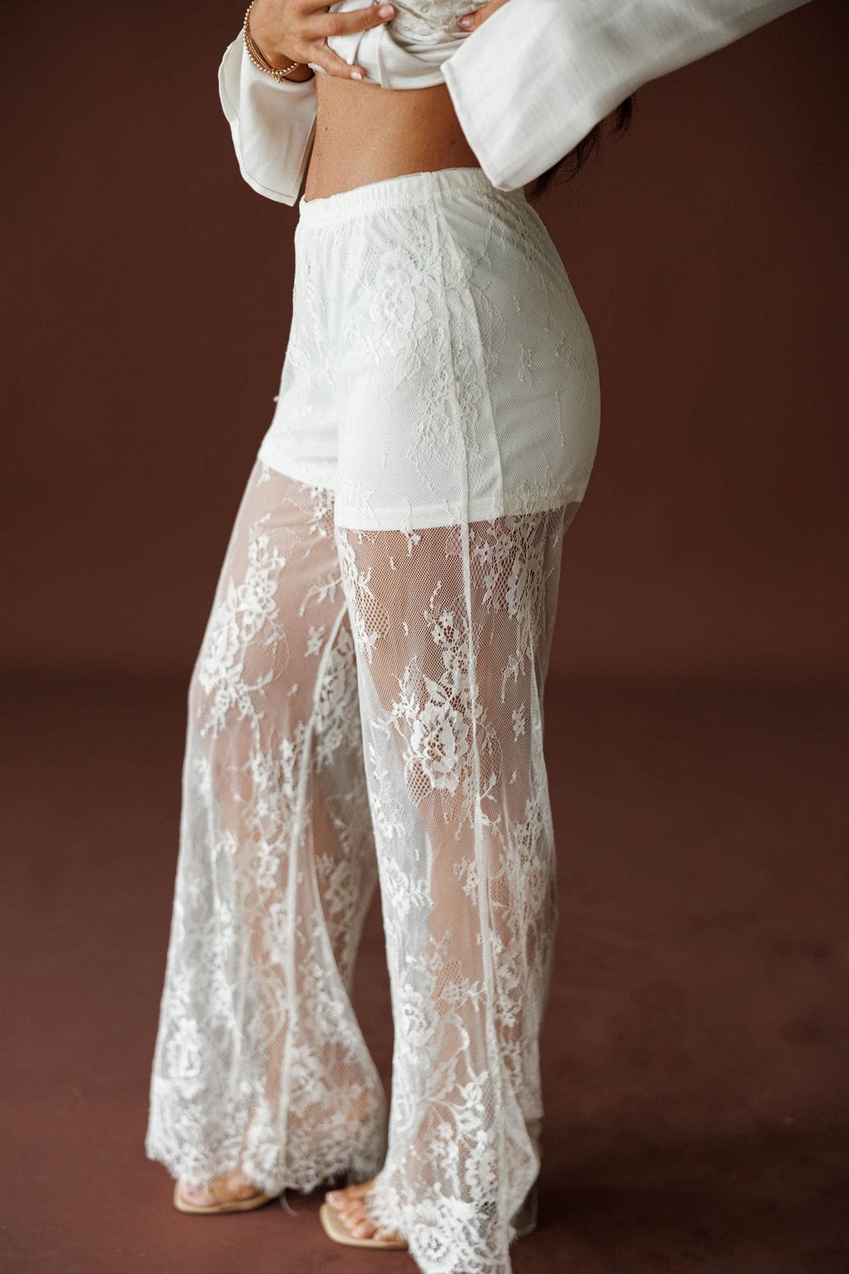 Lace Getaway Pants in champagne, back view showing the sheer lace wide leg