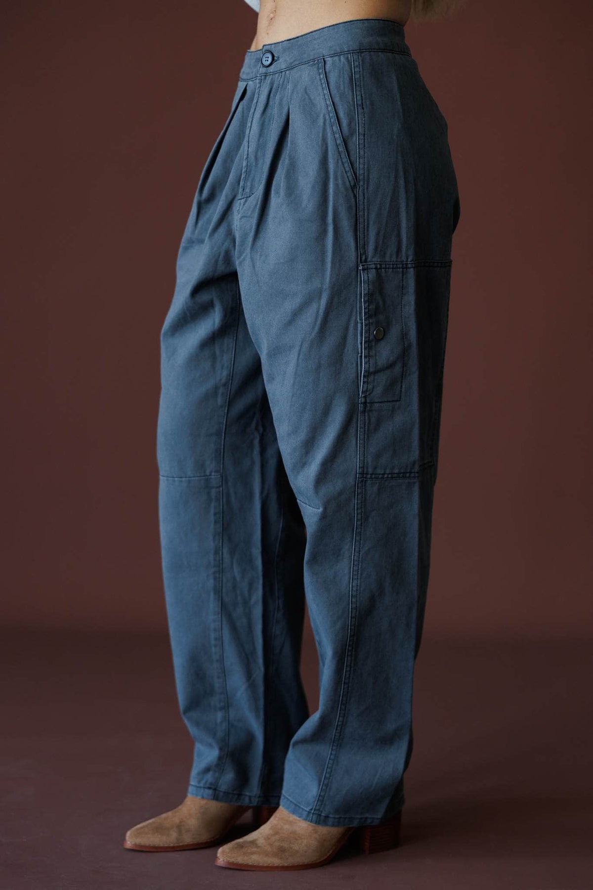 Anywhere But Here Pants in steel, side view showing the utility pocket and wide leg