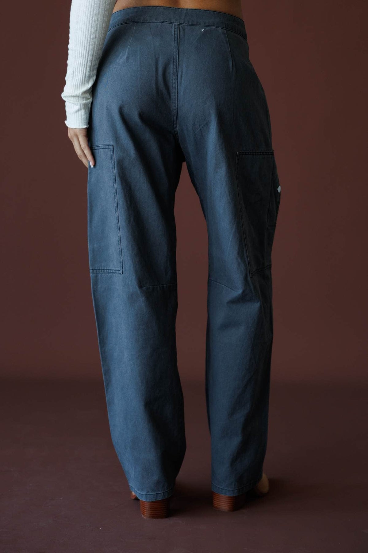 Anywhere But Here Pants in steel, back view showing the pockets and relaxed leg
