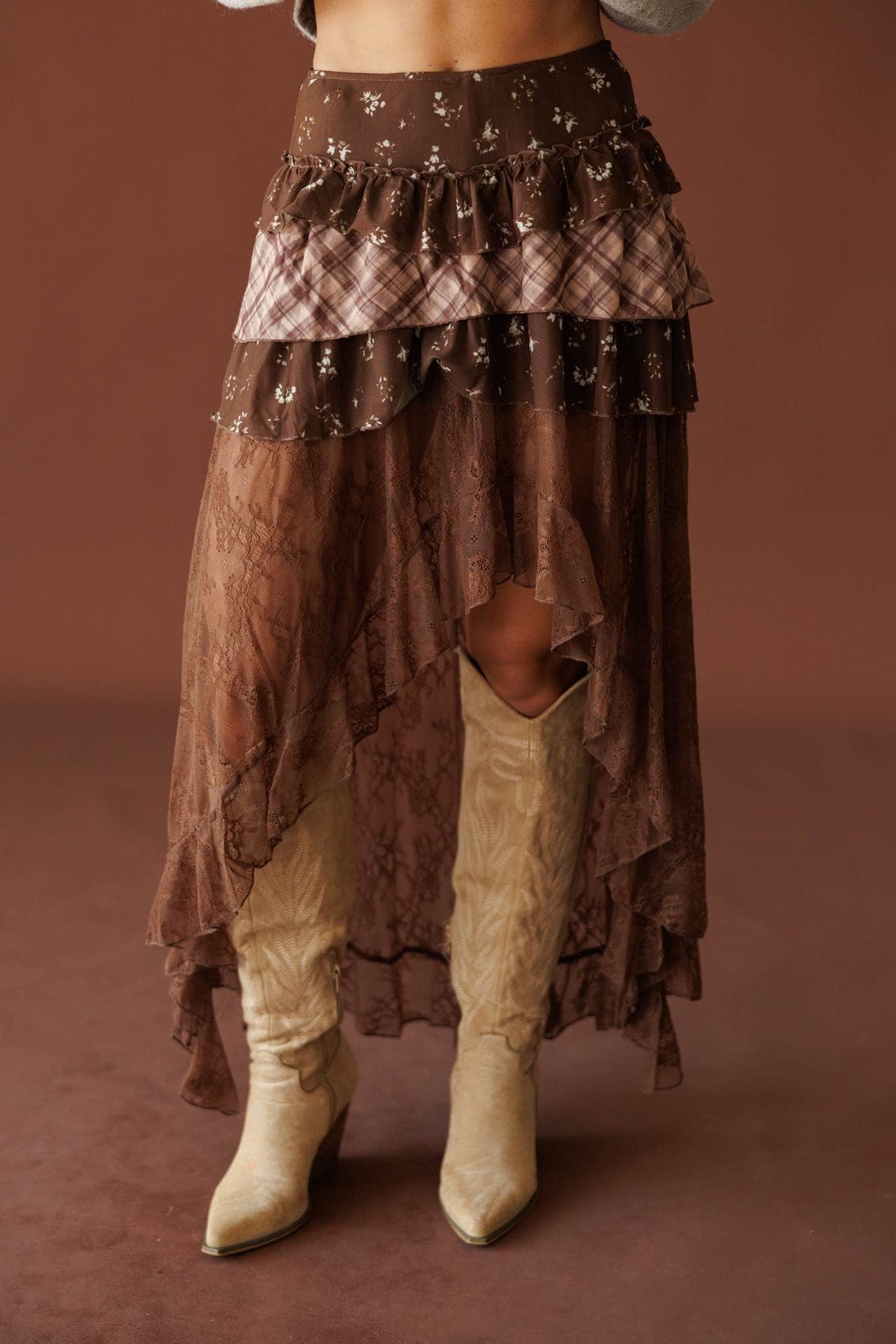 The Storyteller Skirt in brown, front close-up of the tiered lace and sequin trim