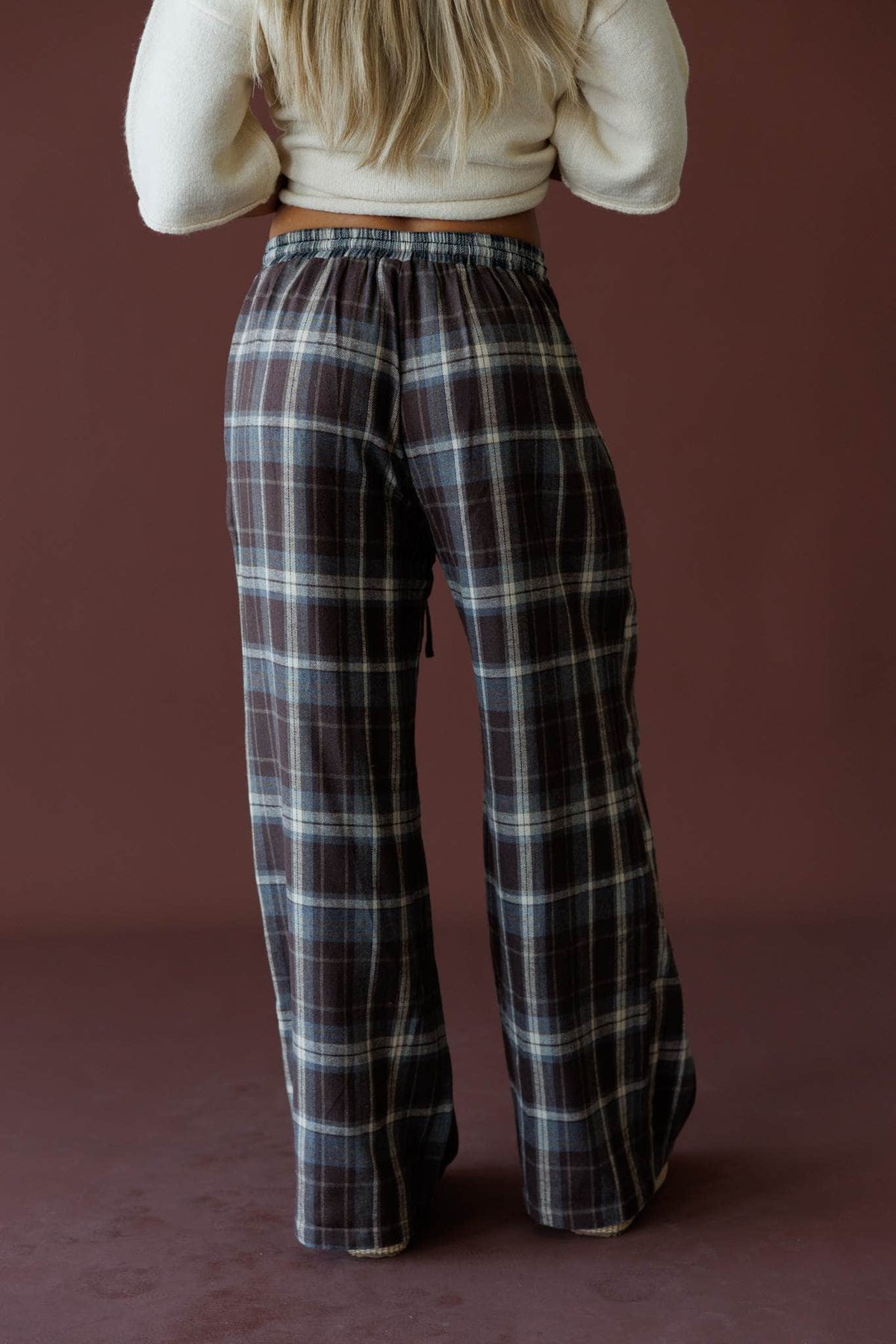 Brown Plaid Boxer Pants in brown, back view showing the wide leg plaid pants