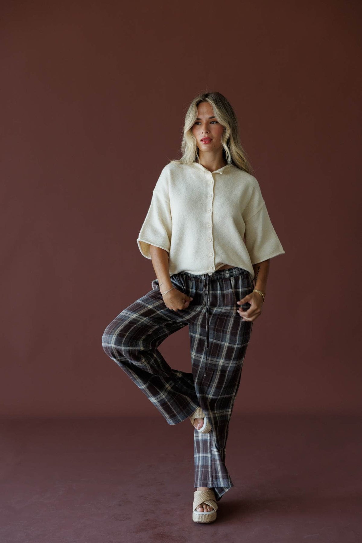 Brown Plaid Boxer Pants in brown, full-length view with a cream cropped top