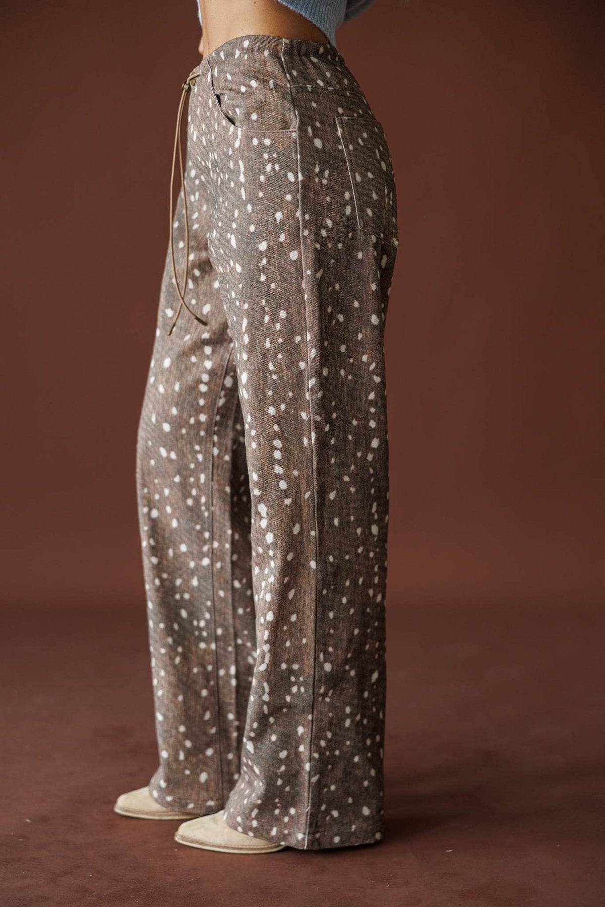 Bambi Wide Leg Pants in brown, side view showing the wide leg deer print pants