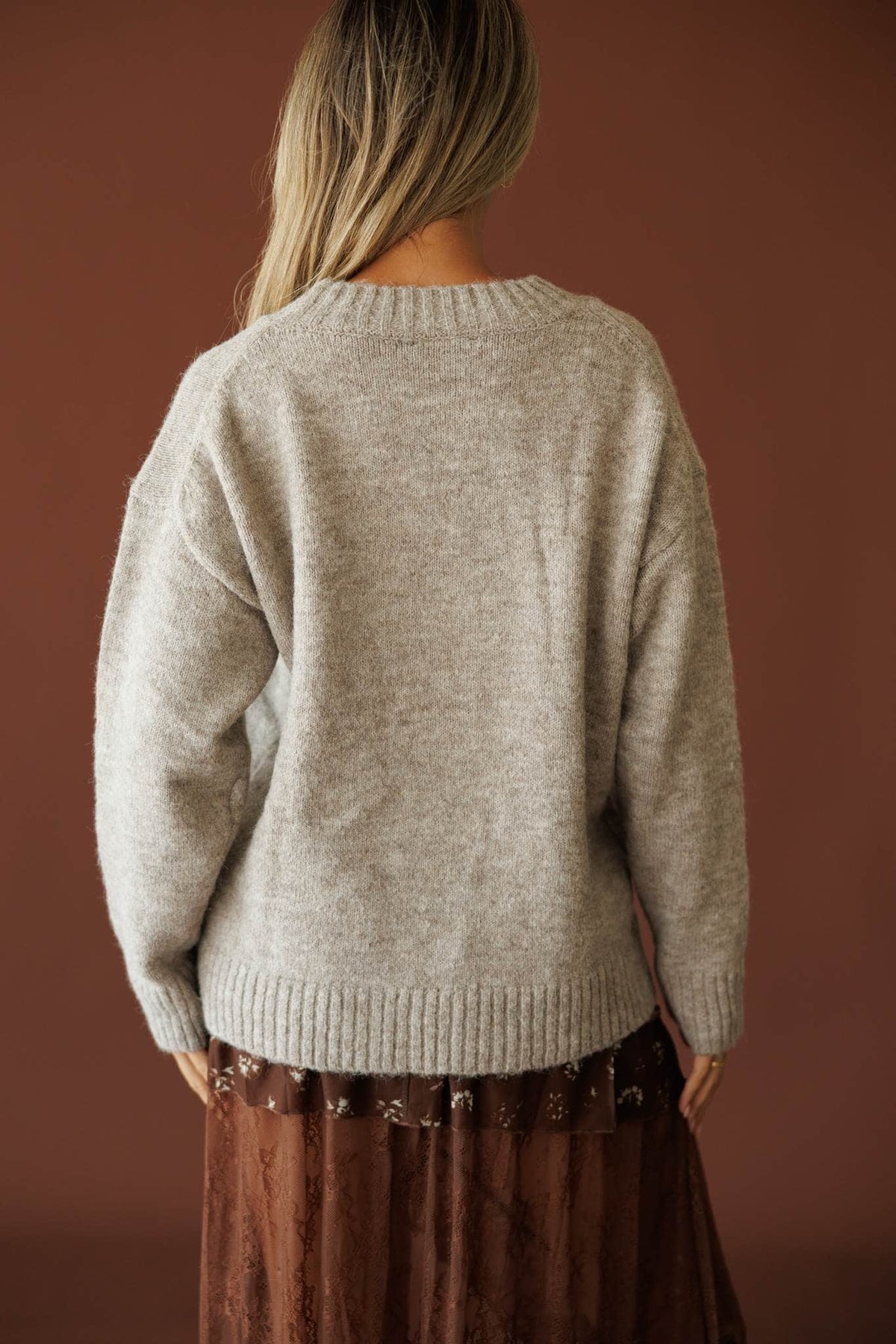 Country Roads Sweater in taupe, back view showing the plain knit back