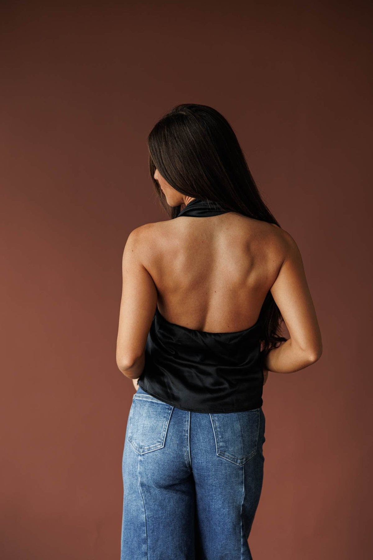 Ivory satin halter top with a draped neckline