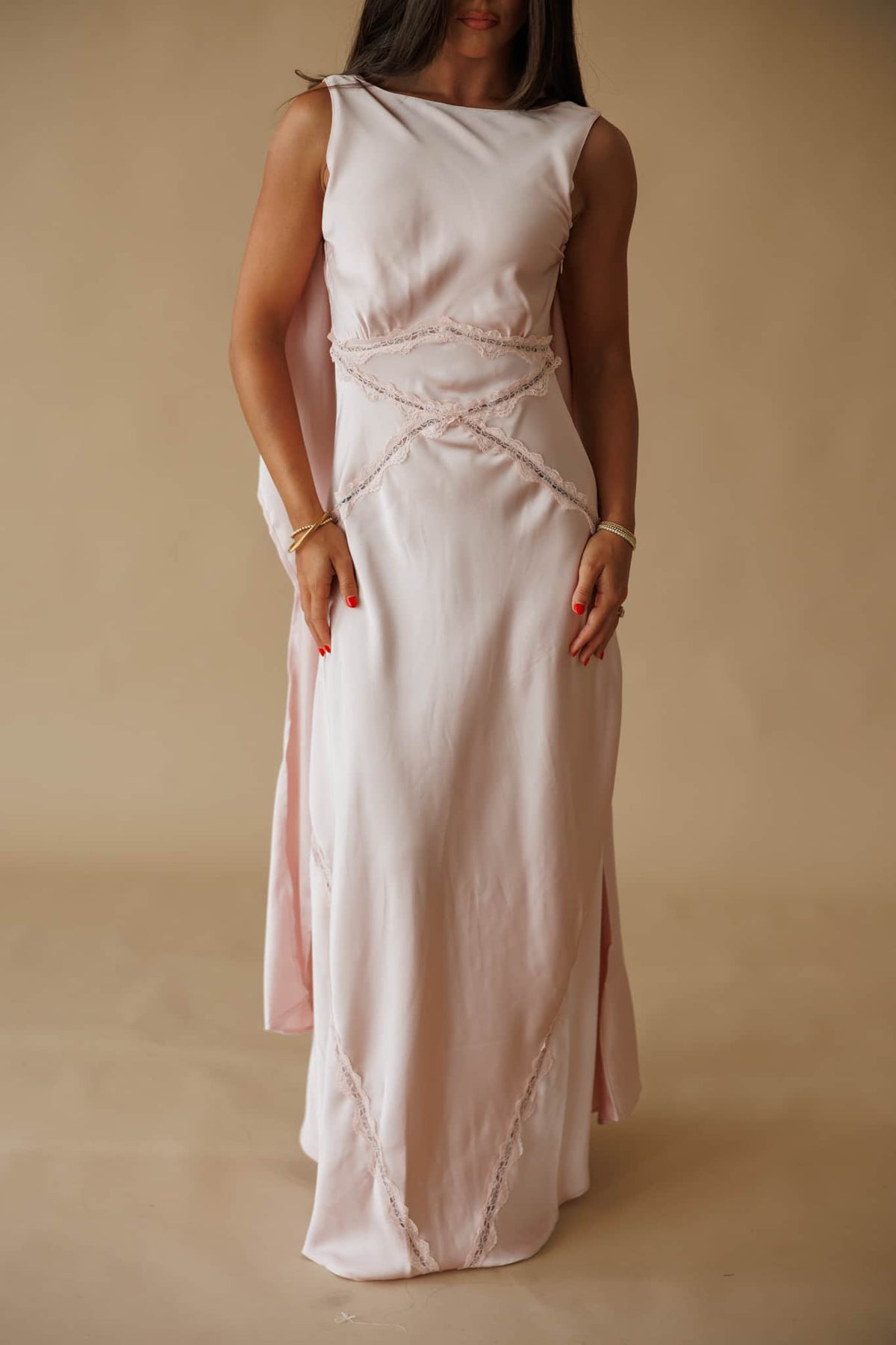 Chasing Forever Dress in dusty pink, front close-up of the crossover waist seams