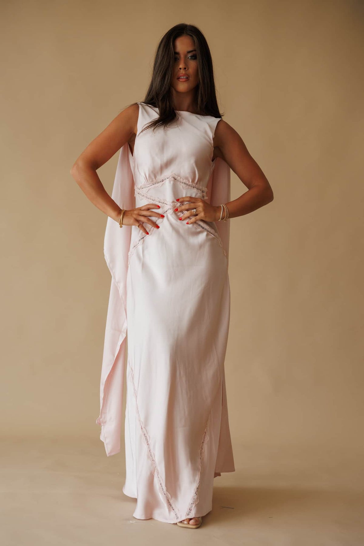 Chasing Forever Dress in dusty pink, front view on model with hands on hips