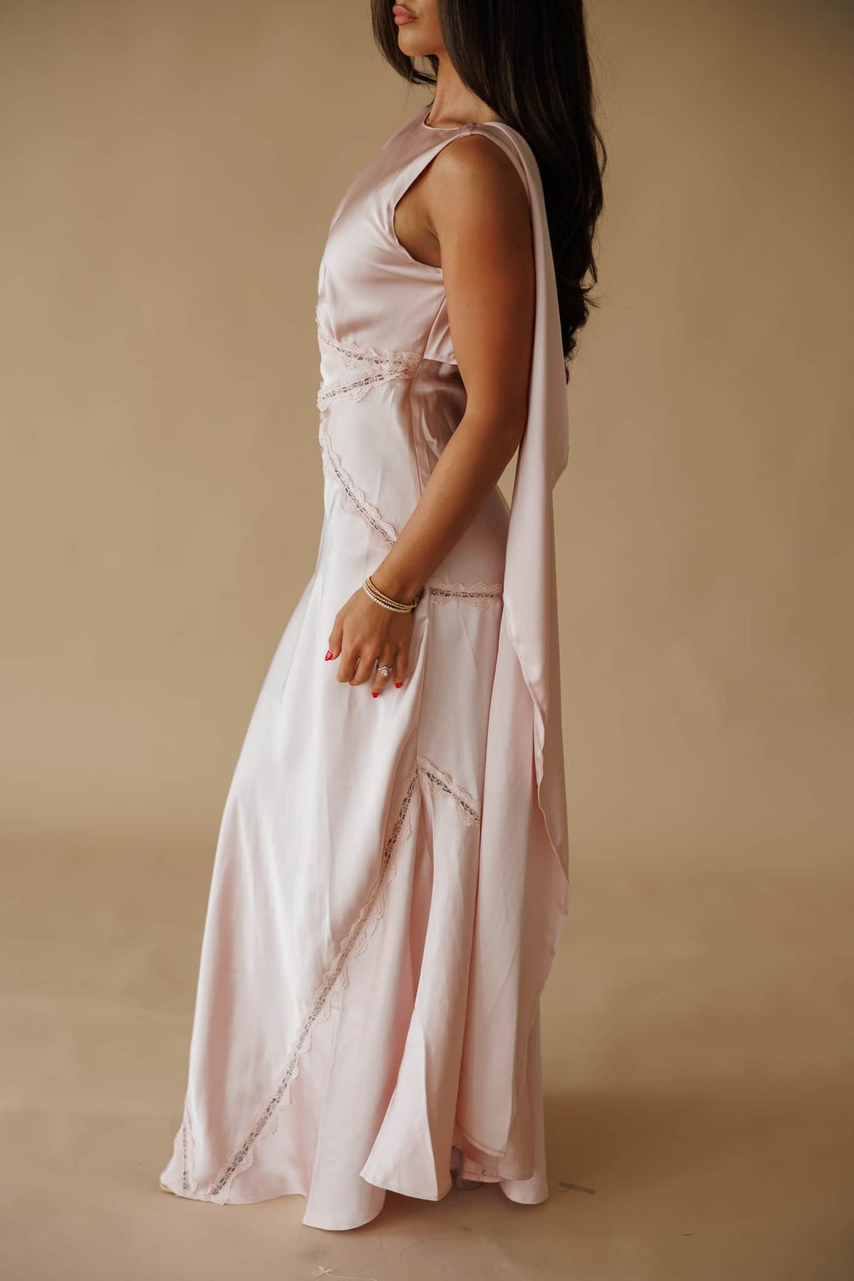 Chasing Forever Dress in dusty pink, side view showing the bias cut skirt