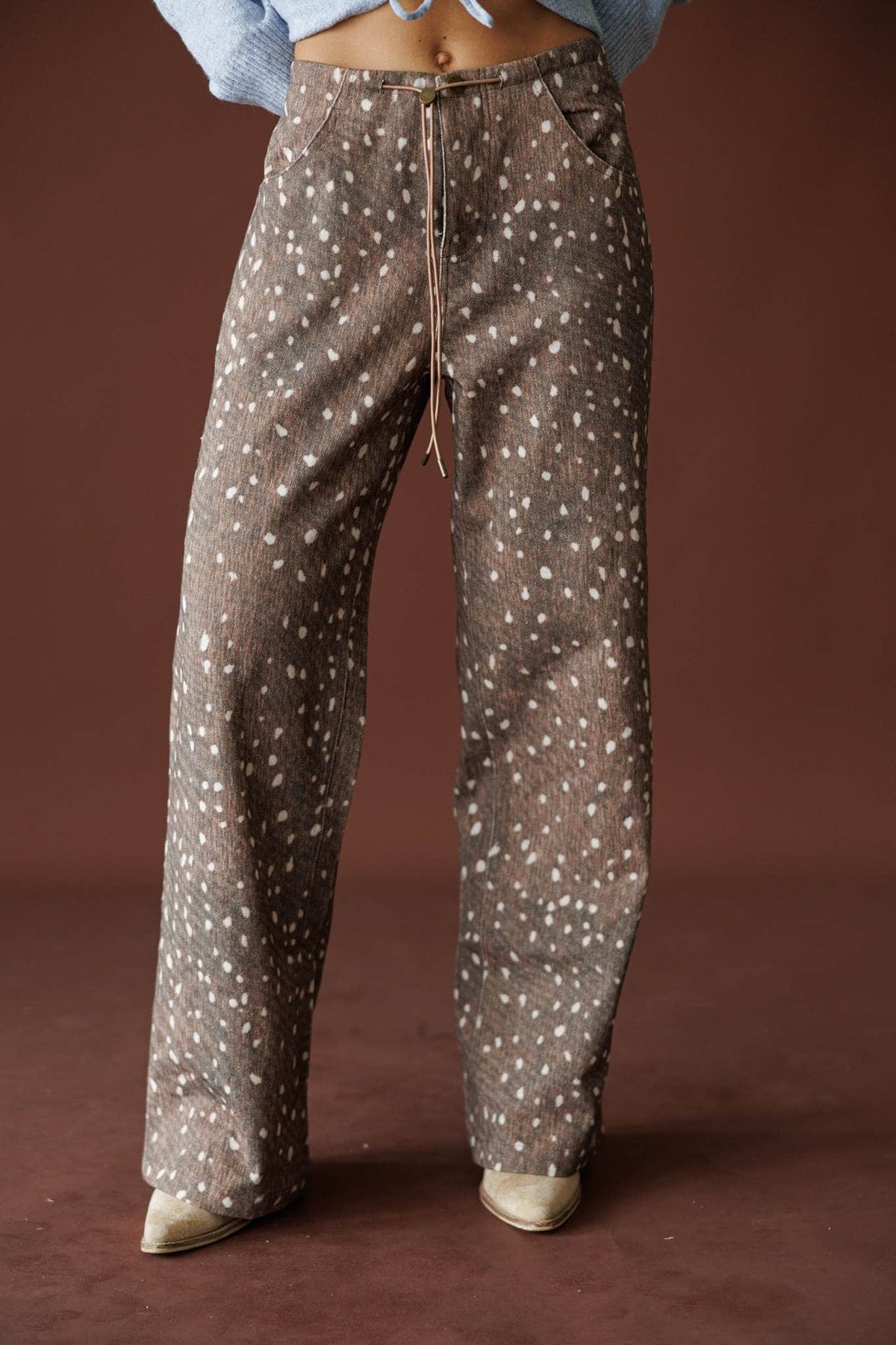 Bambi Wide Leg Pants in brown, front close-up of the deer print and high rise waist