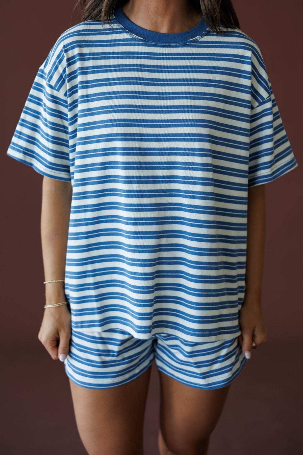 Doing Things Tee in dusty blue, front close-up of the ribbed crew neck and horizontal stripes