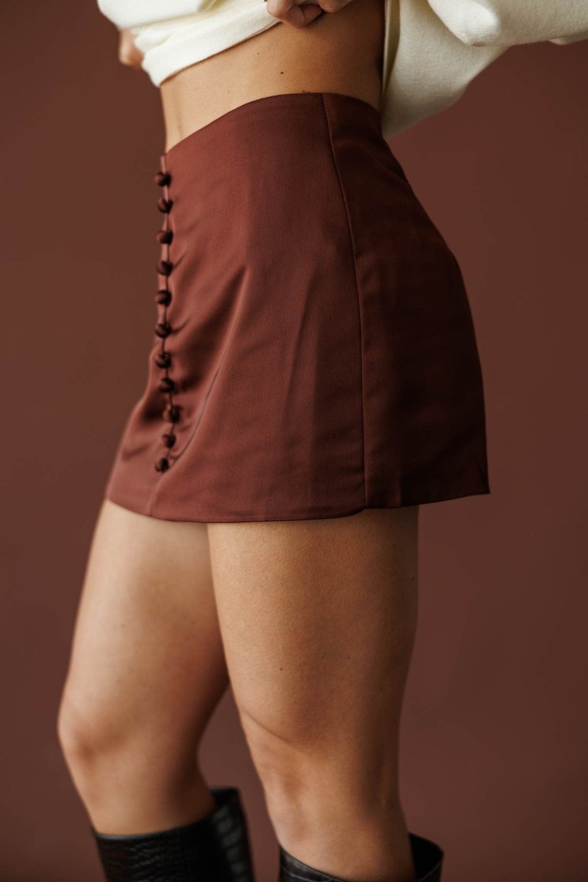 Button Up Satin Skort, in crimson brown, side view of the button front