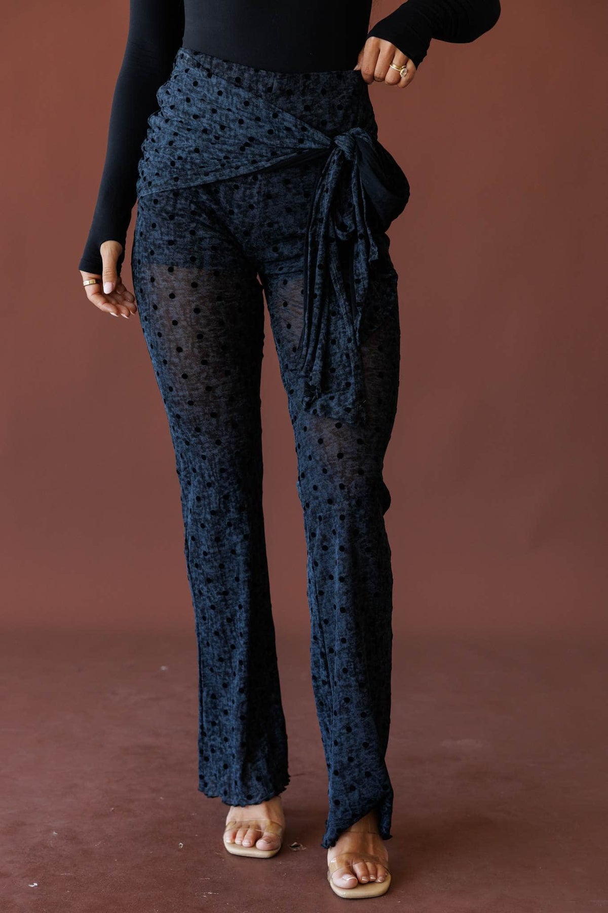 Grey polka dot mesh pants, front view