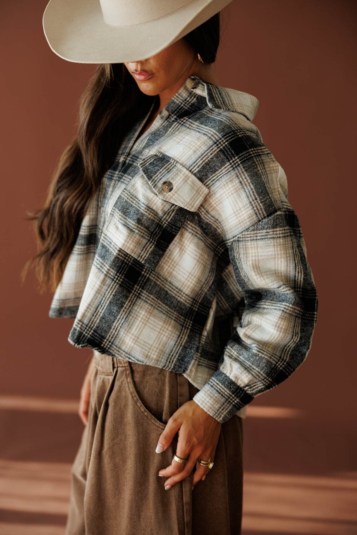 Fringe Lane Plaid Shacket in ivory and black, front view on model with a cream hat