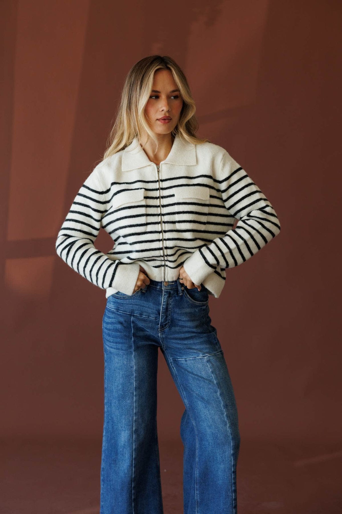 Cream and black sweater jacket, front view