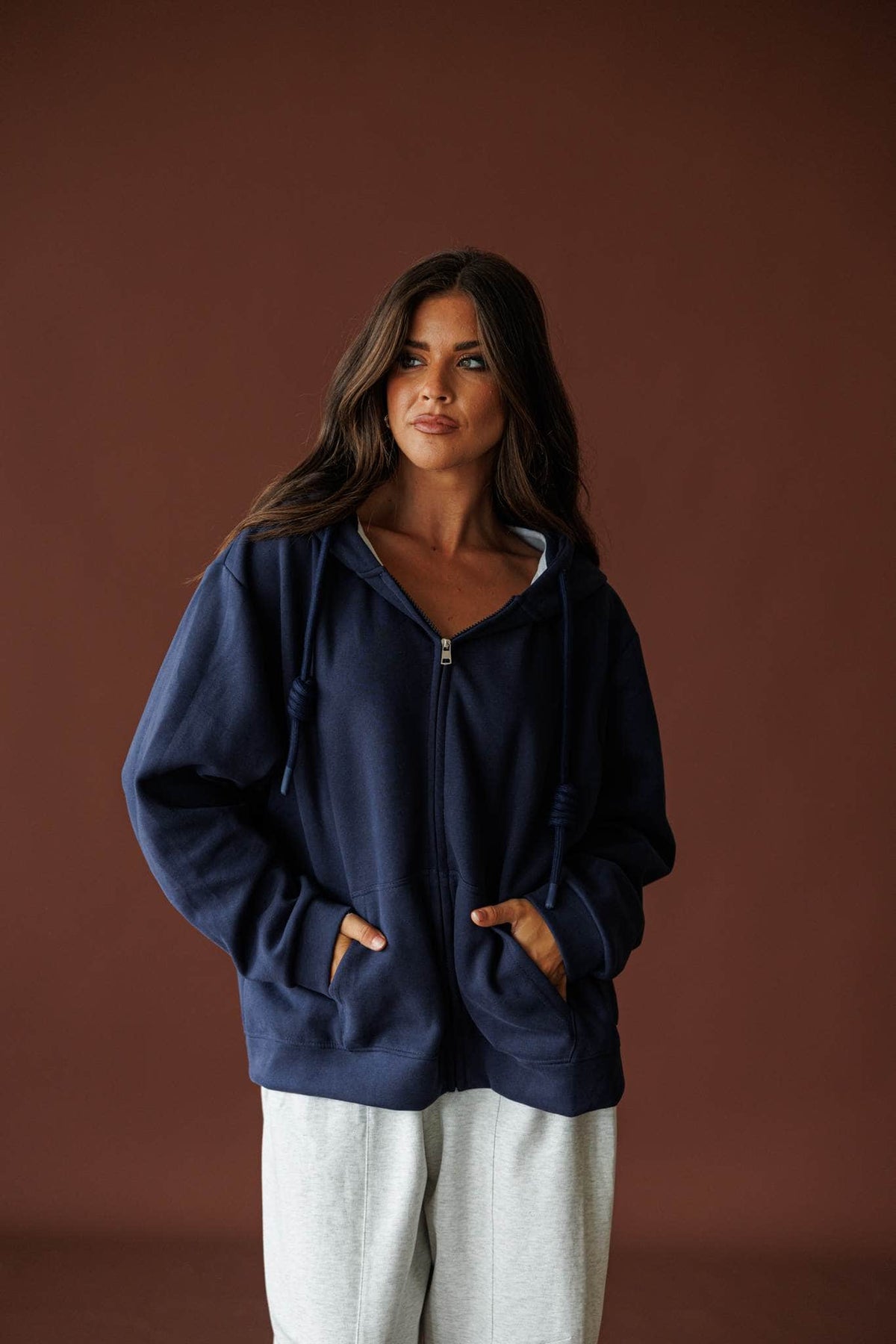 On Standby Zip Up Jacket in navy, full-length view with cream wide-leg pants