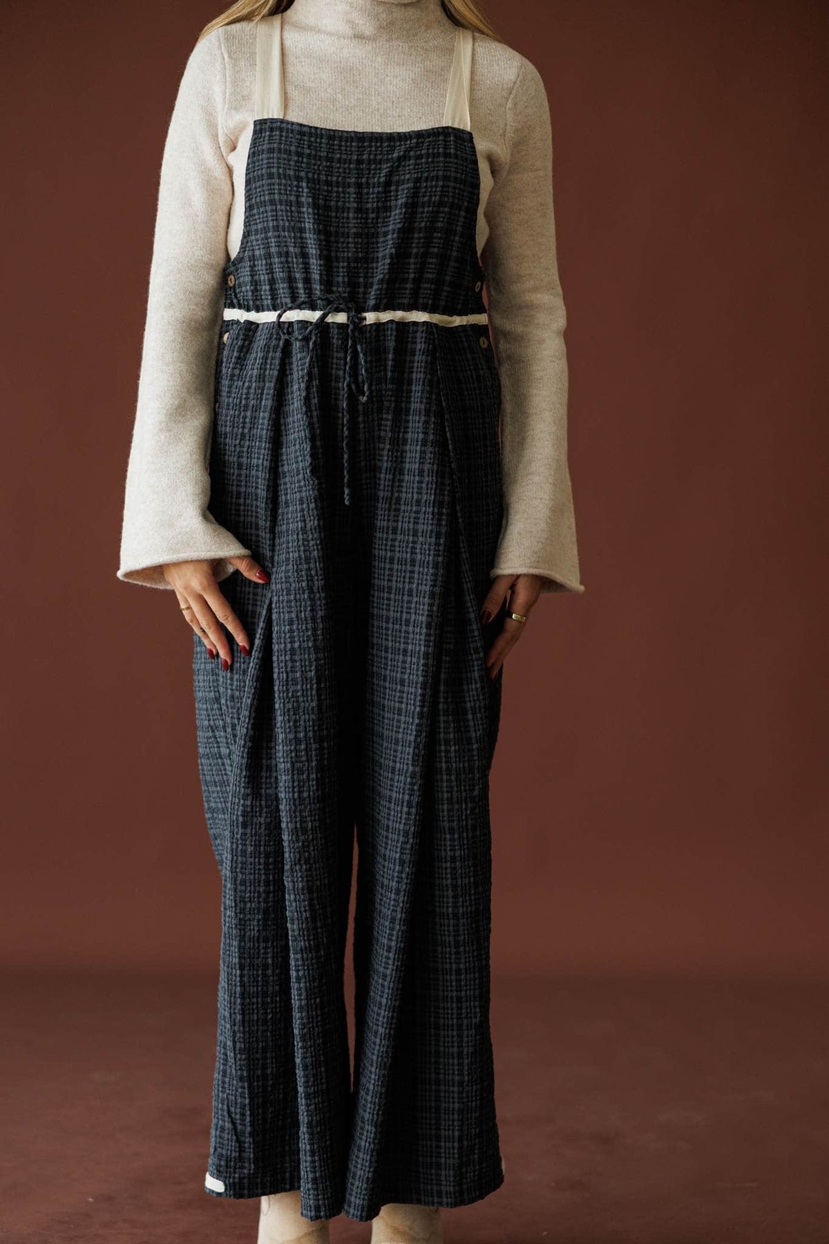 Field Trip Overalls in black plaid, front view of the wide-leg silhouette