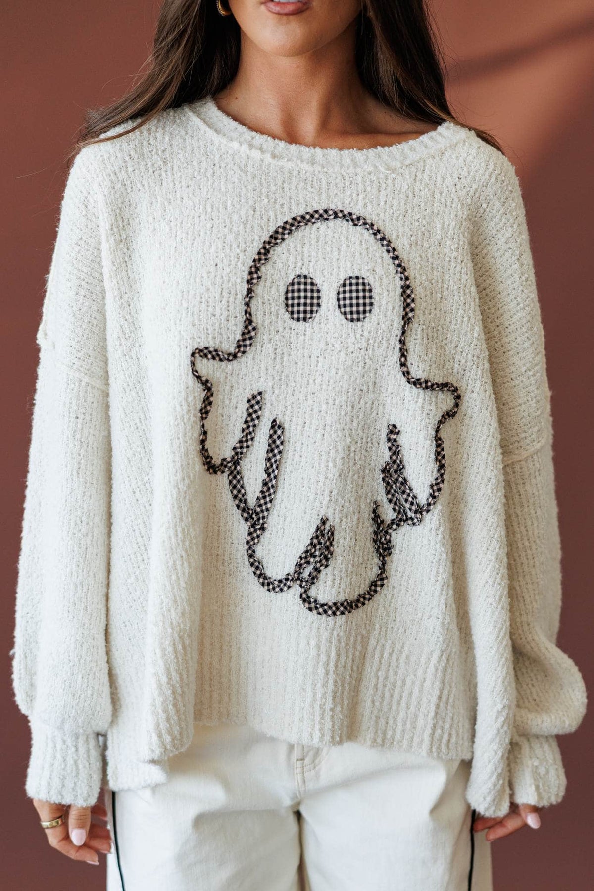 Friendly Ghost Sweater, front view of the ghost graphic on boucle knit