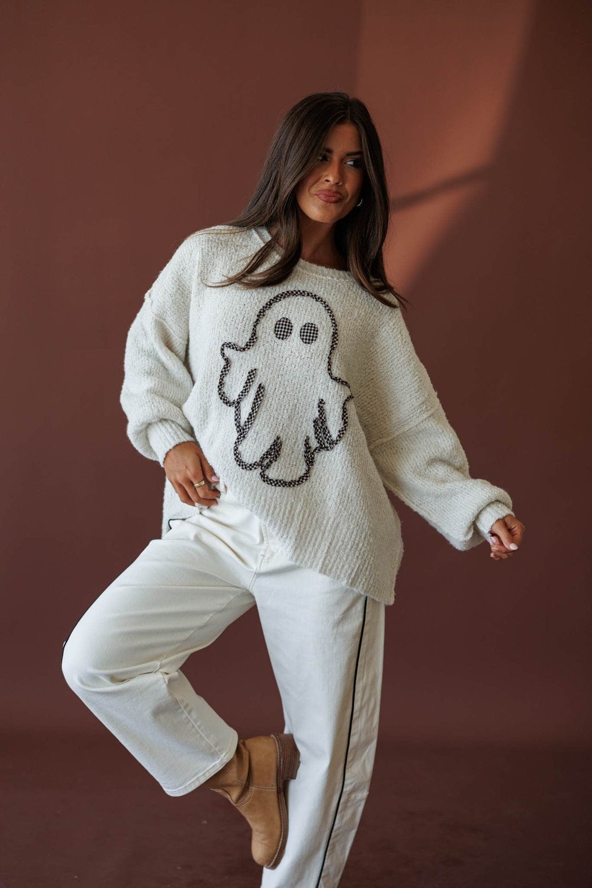 Friendly Ghost Sweater, full-length view with cream pants