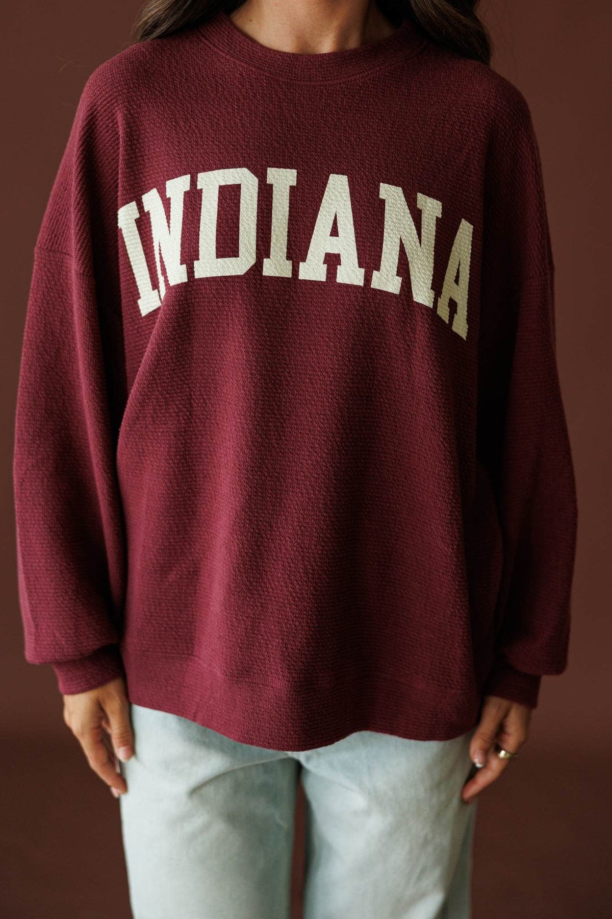 Indiana Cloud Knit Sweatshirt in wine, front close-up of the arched INDIANA lettering