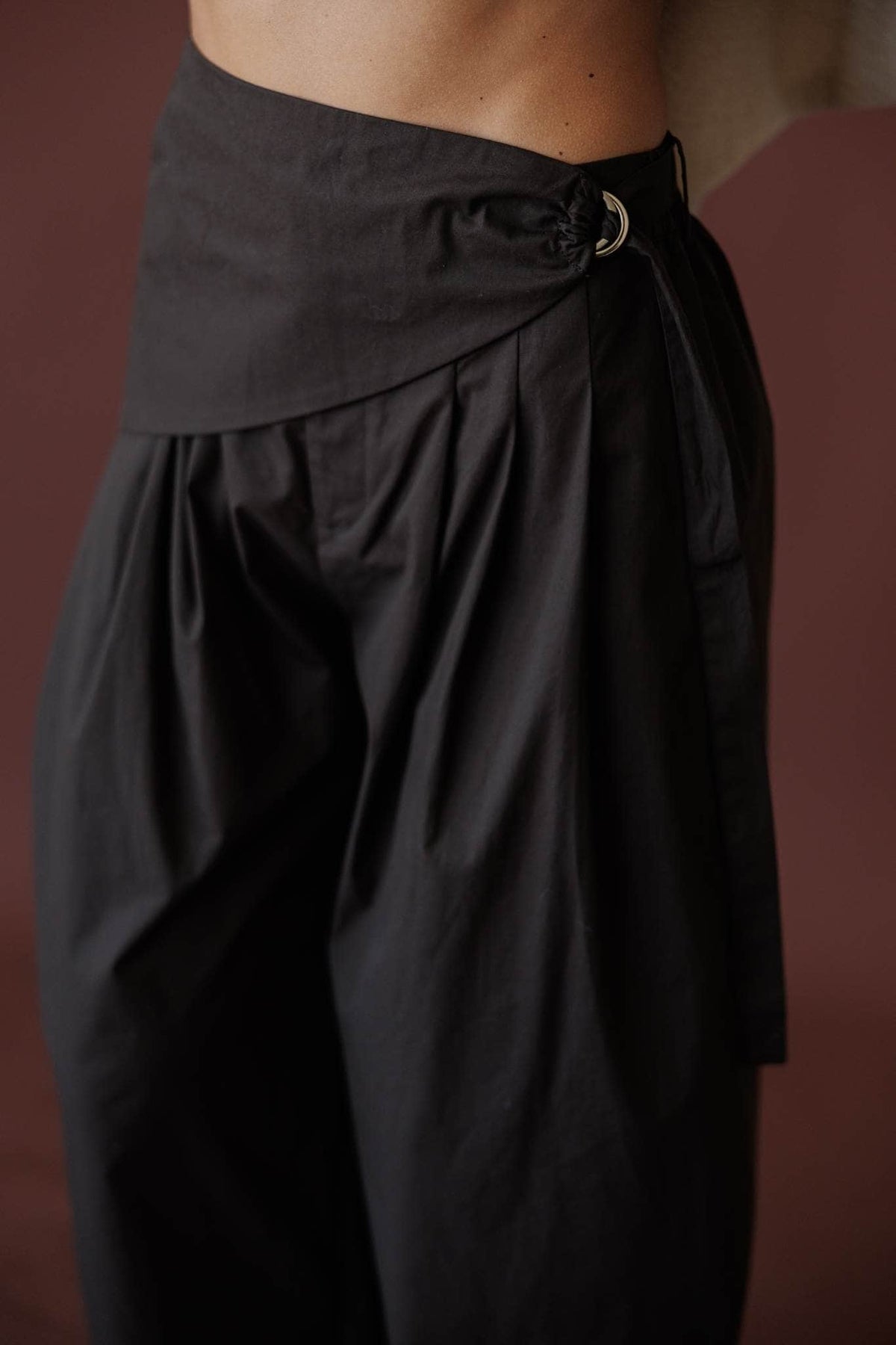 Scarf Tie Trouser, in dark chocolate, close view of the wrap and ring detail