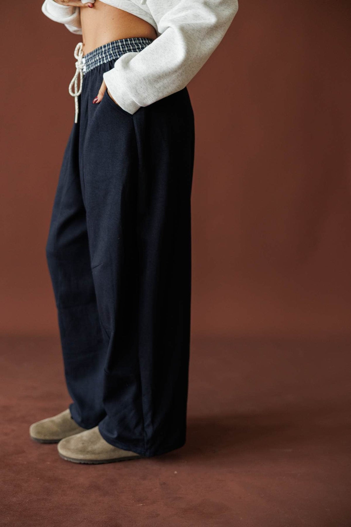 Slow Down Wide Leg Joggers in navy, side view of the wide leg with booties