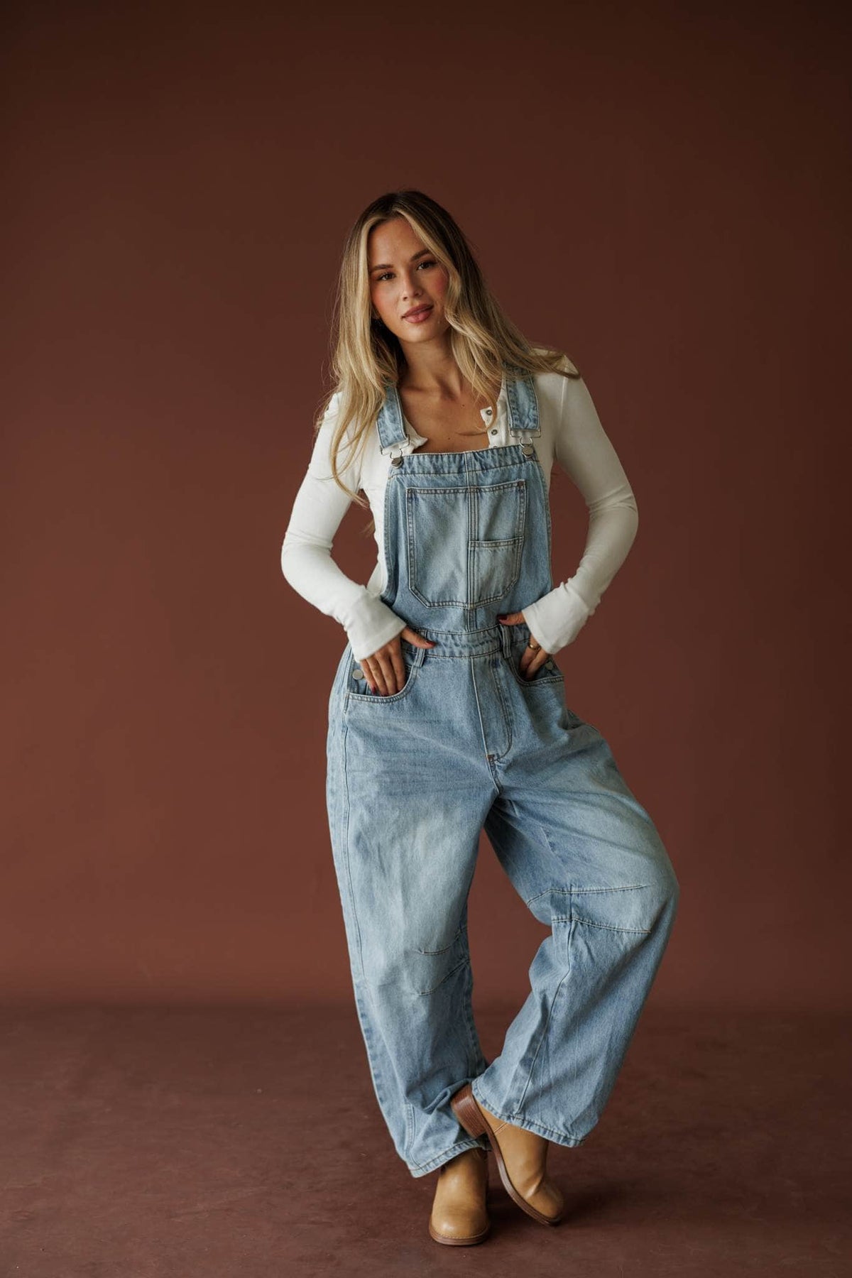 Light wash denim overalls, front view