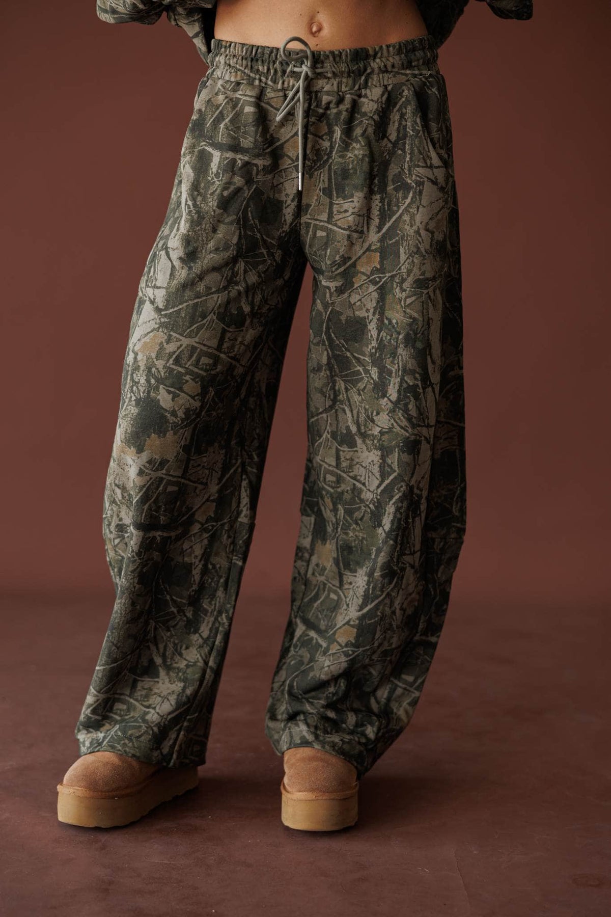 Olive camo low rise barrel jogger pants, front view
