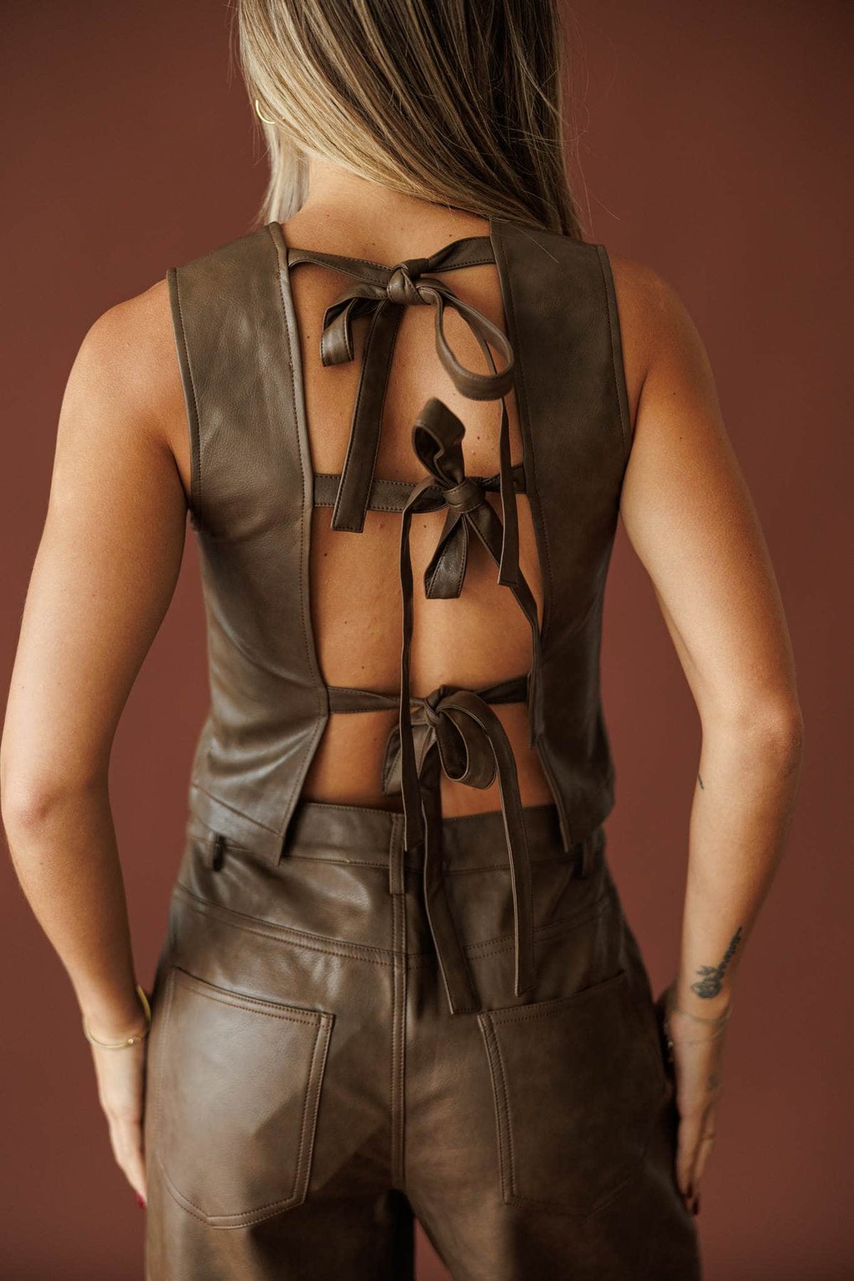Trouble Tonight Leather Top in brown, back view of the open tie-back detail