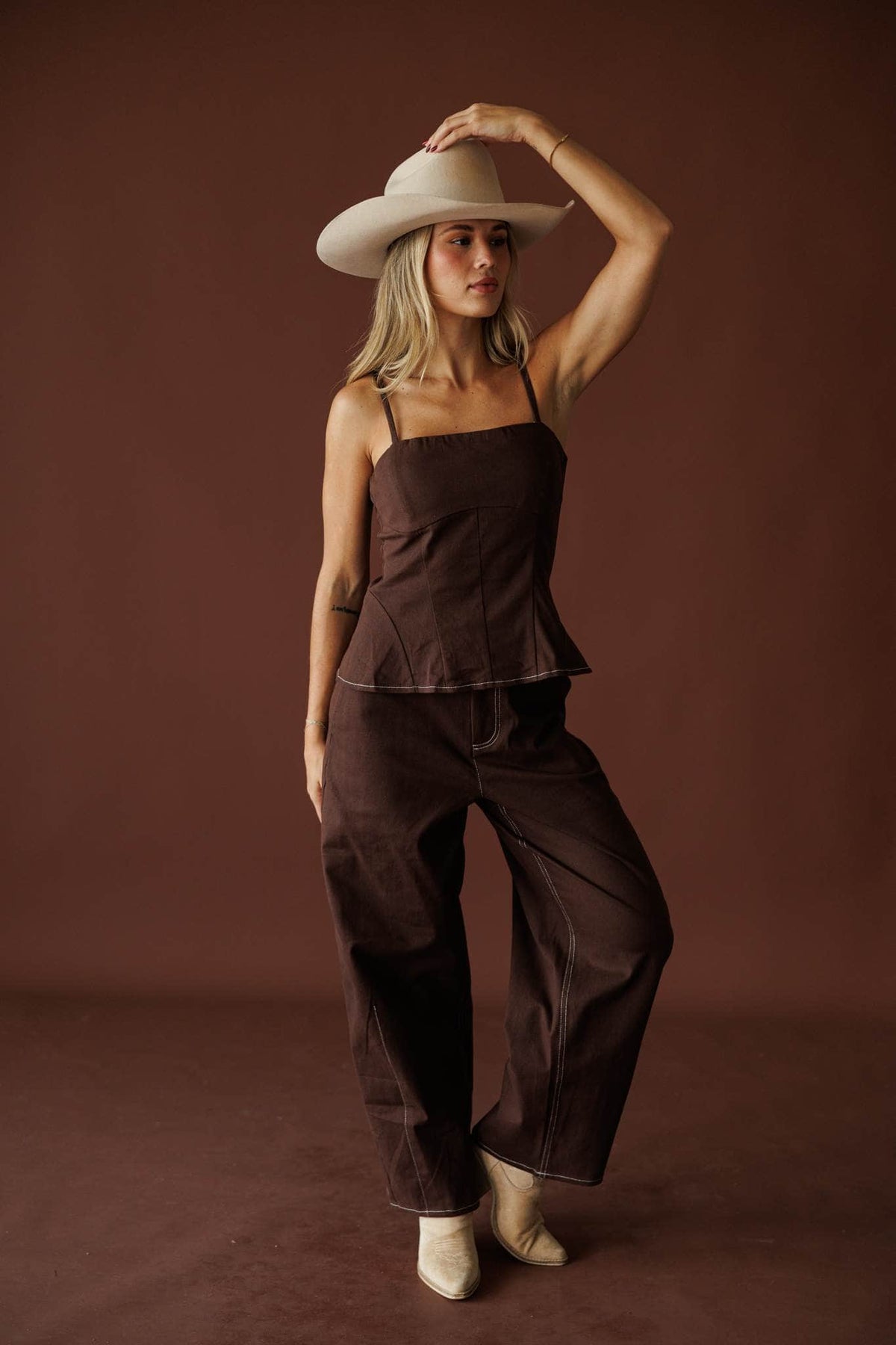 Roadhouse Peplum Top in brown, front view of the straight neckline and thin straps