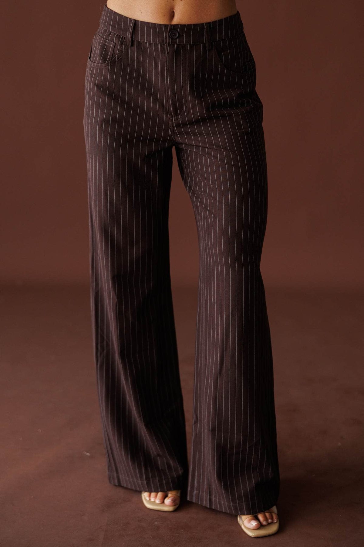 Members Only Pants in brown pinstripe, front view of the wide leg with sandals