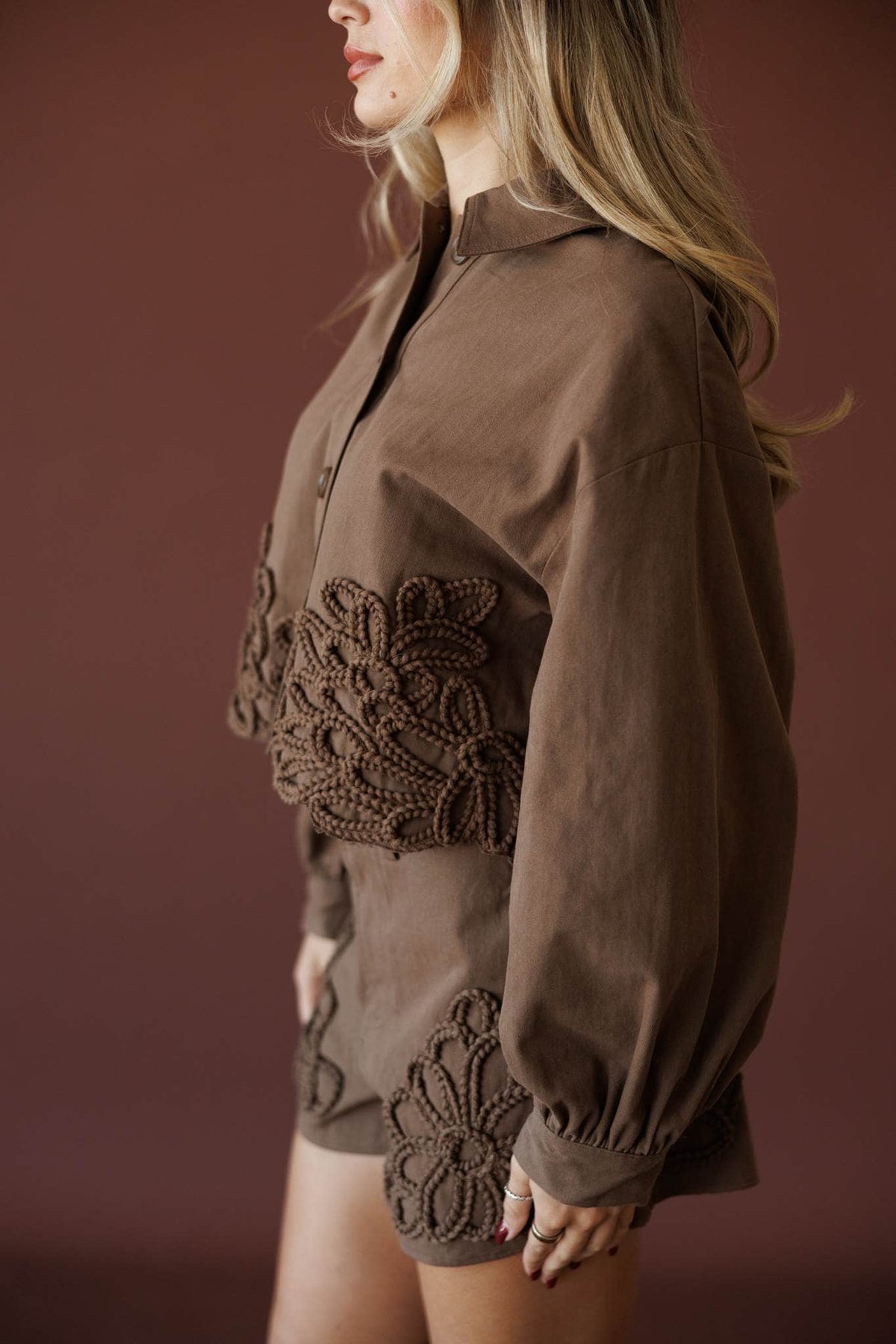 Wildflower Utility Jacket, in brown, close view of the crochet floral appliqué