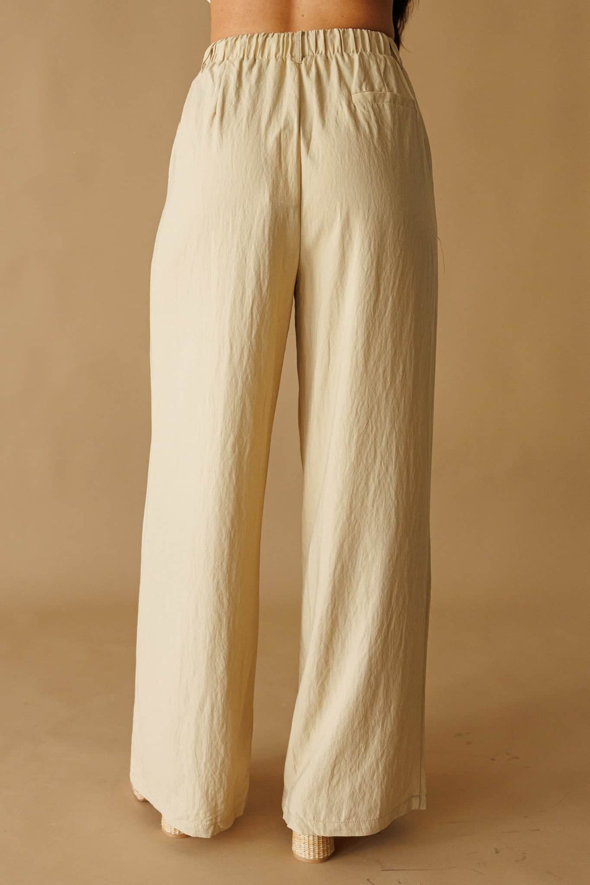 Laguna Linen Pant in natural, front view showing the elastic waist and drape