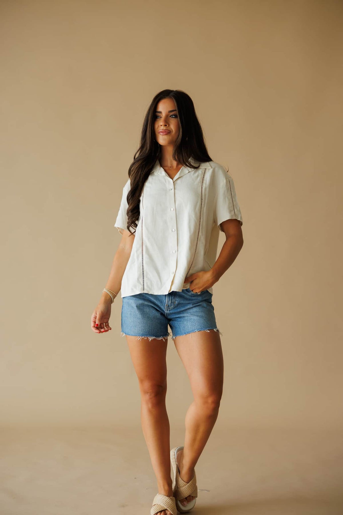 The Coastline Shirt in cream, full-length view on model walking