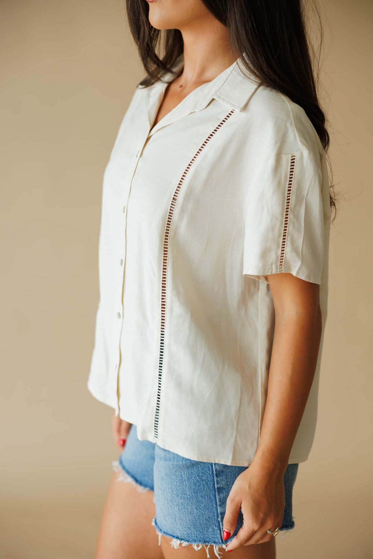 The Coastline Shirt in cream, side view showing the camp collar and short sleeve