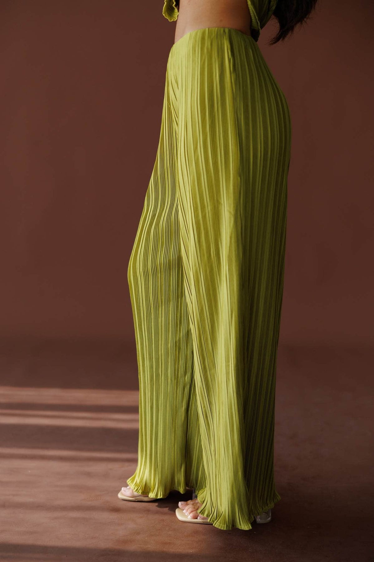 Muse Moments Pleated Pants in olive, side view showing the pleated wide leg