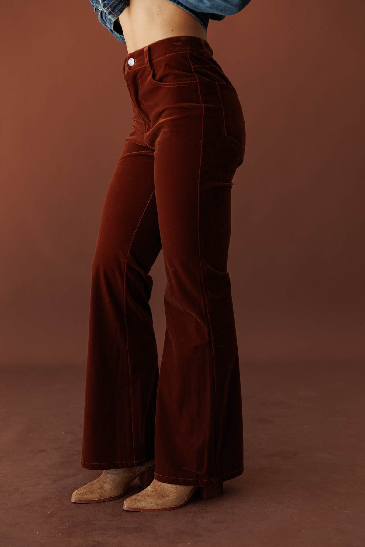After Dark Velvet Flare Pants, in mulberry, side view of the high rise