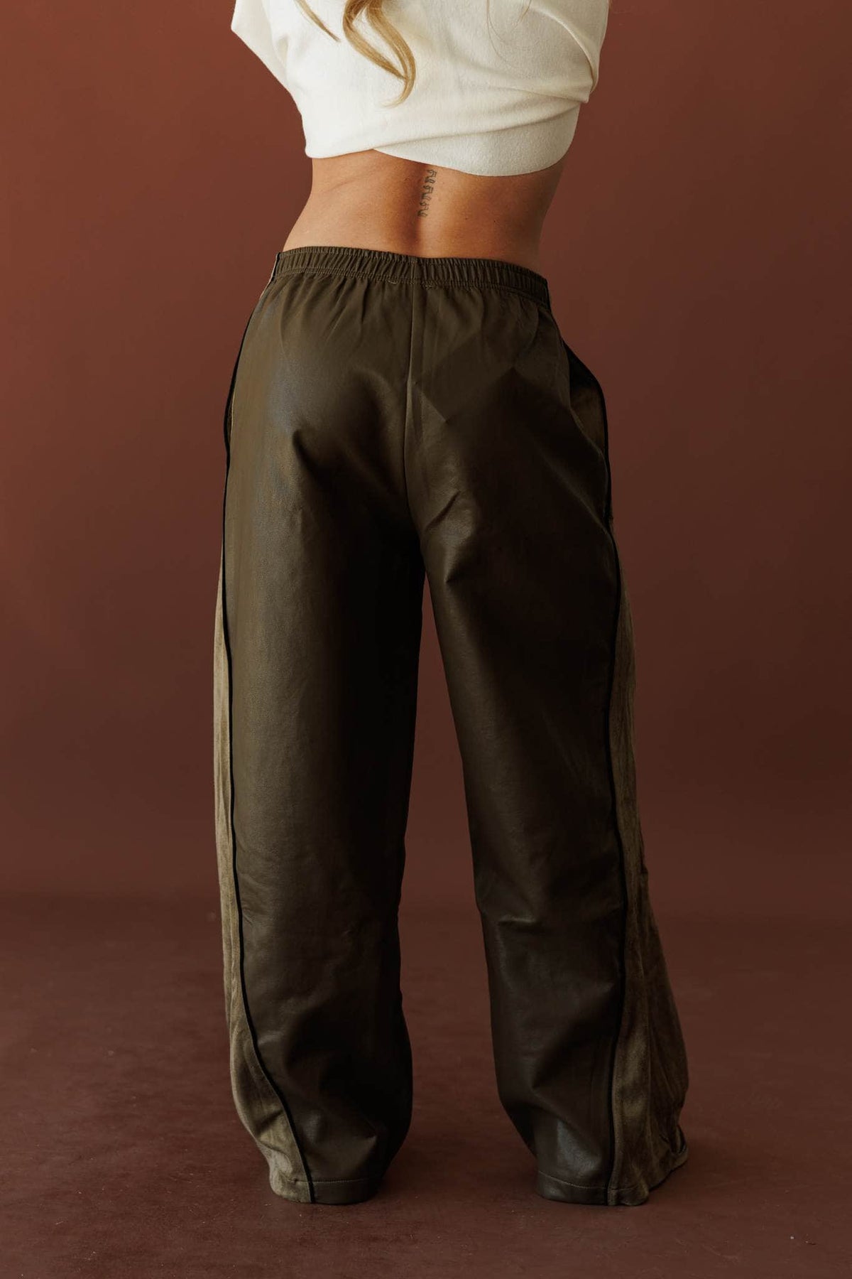 Expedition Suede Pants, in olive, back view of the gathered waist