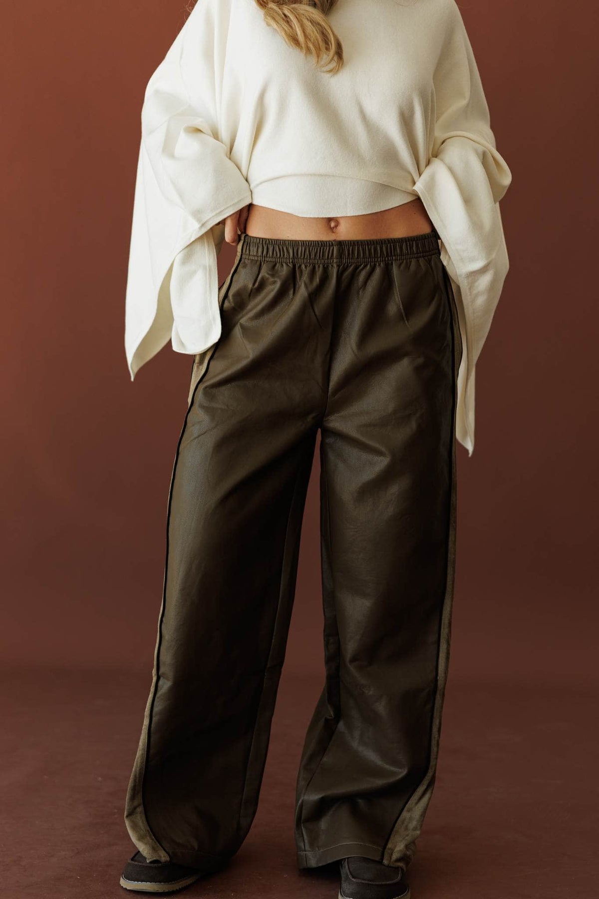 Expedition Suede Pants, in olive, full-length view with a cream top