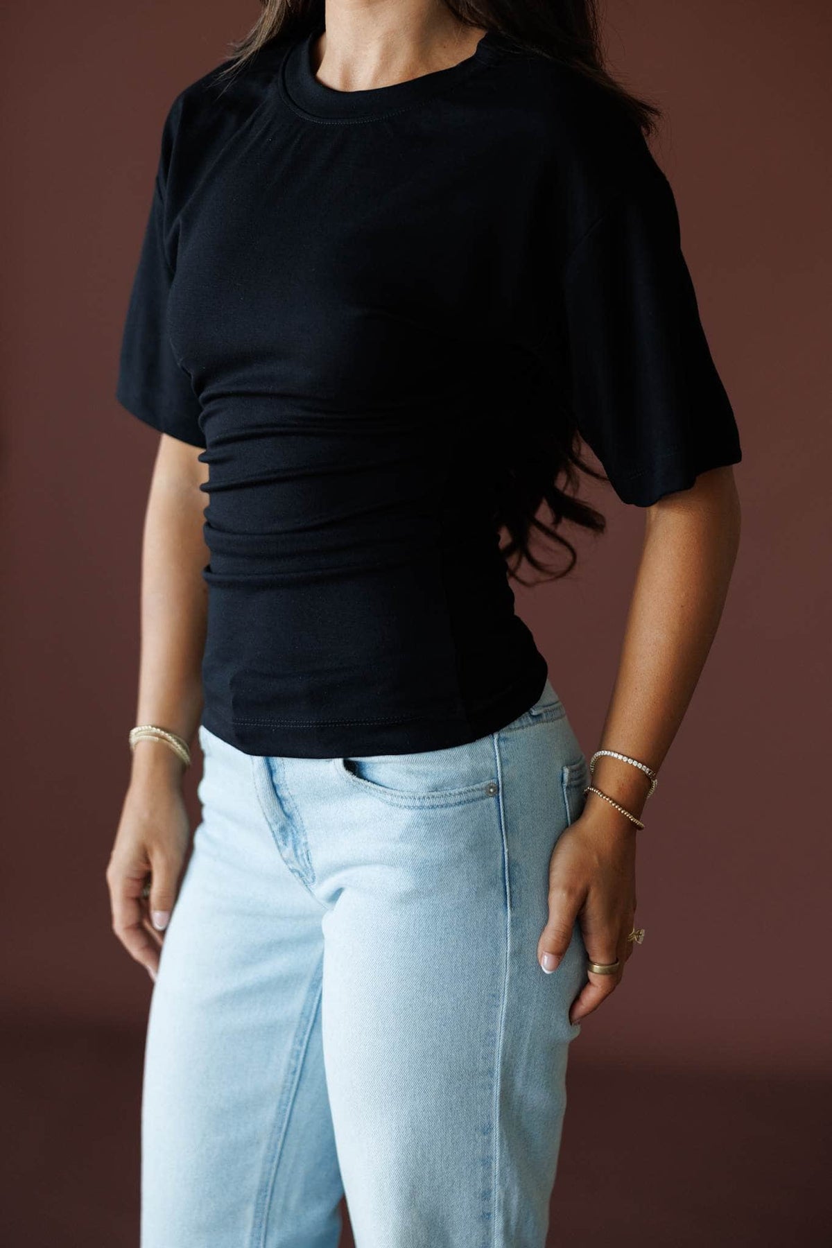 One Sided Ruched Tee in black, front close-up showing the gathered ruching along one side