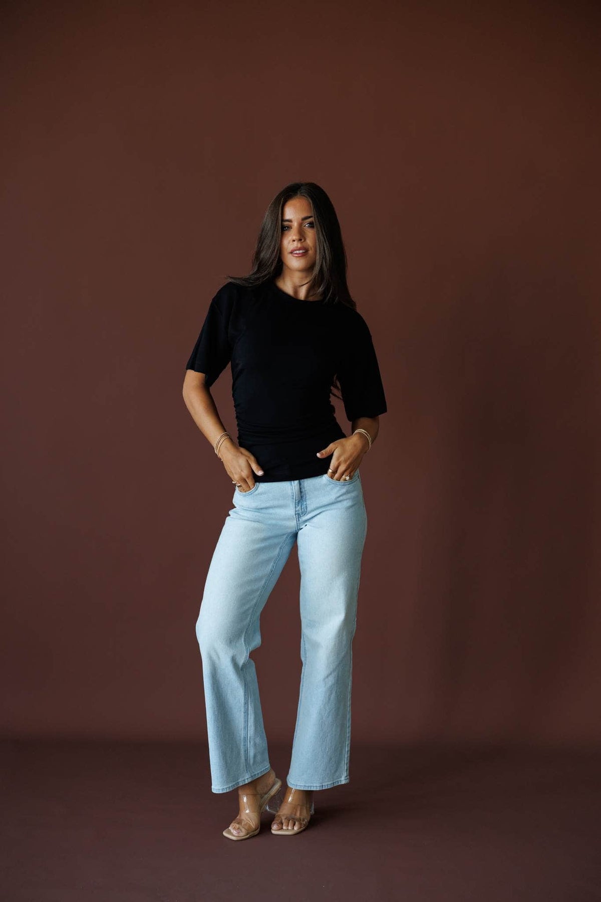One Sided Ruched Tee in black, full-length front view on model with wide leg jeans