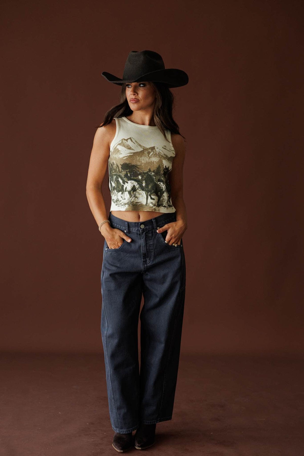 Open Range Graphic Knit Tank in beige, full-length view on model with a black hat
