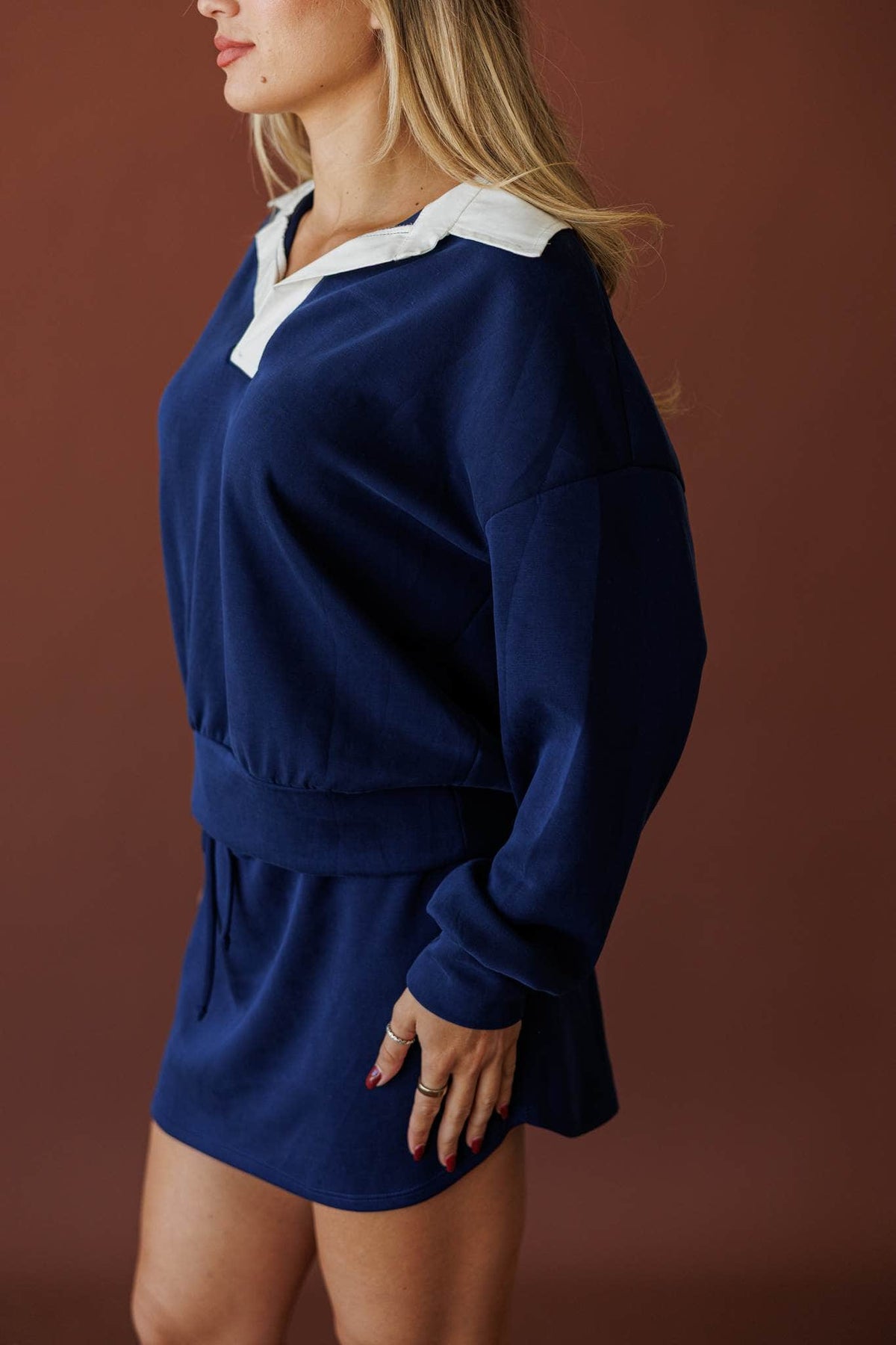 Overtime Scuba Top, in navy, side view of the dropped shoulder