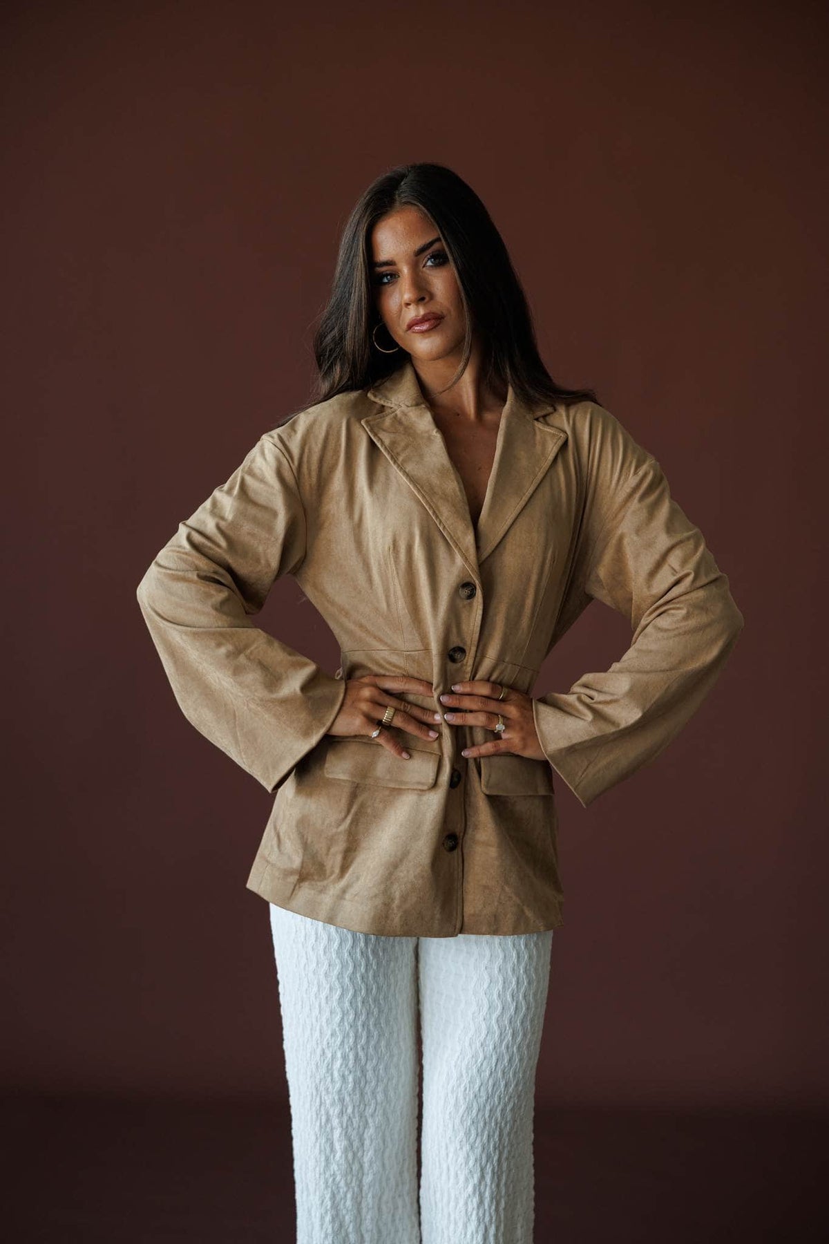 Paddock Suede Blazer in light brown, front view on model with hands on hips