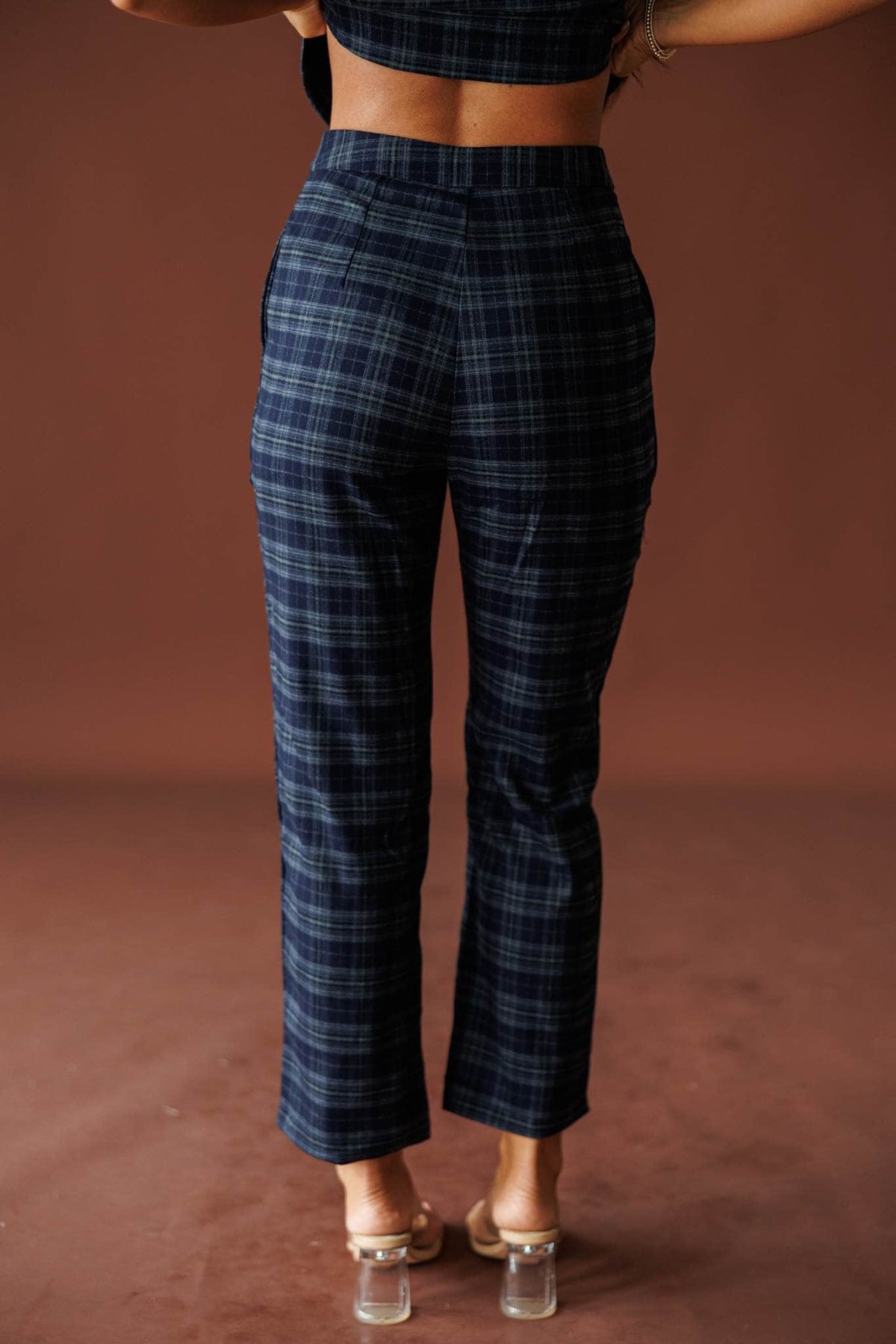 The Socialite Pants in teal plaid, back view of the tailored straight leg