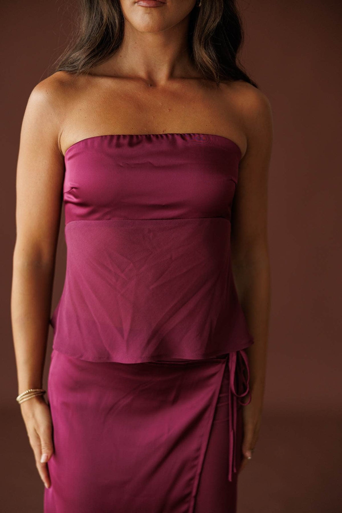 Plum Hour Satin Tube Top in plum, front close-up of the structured satin band