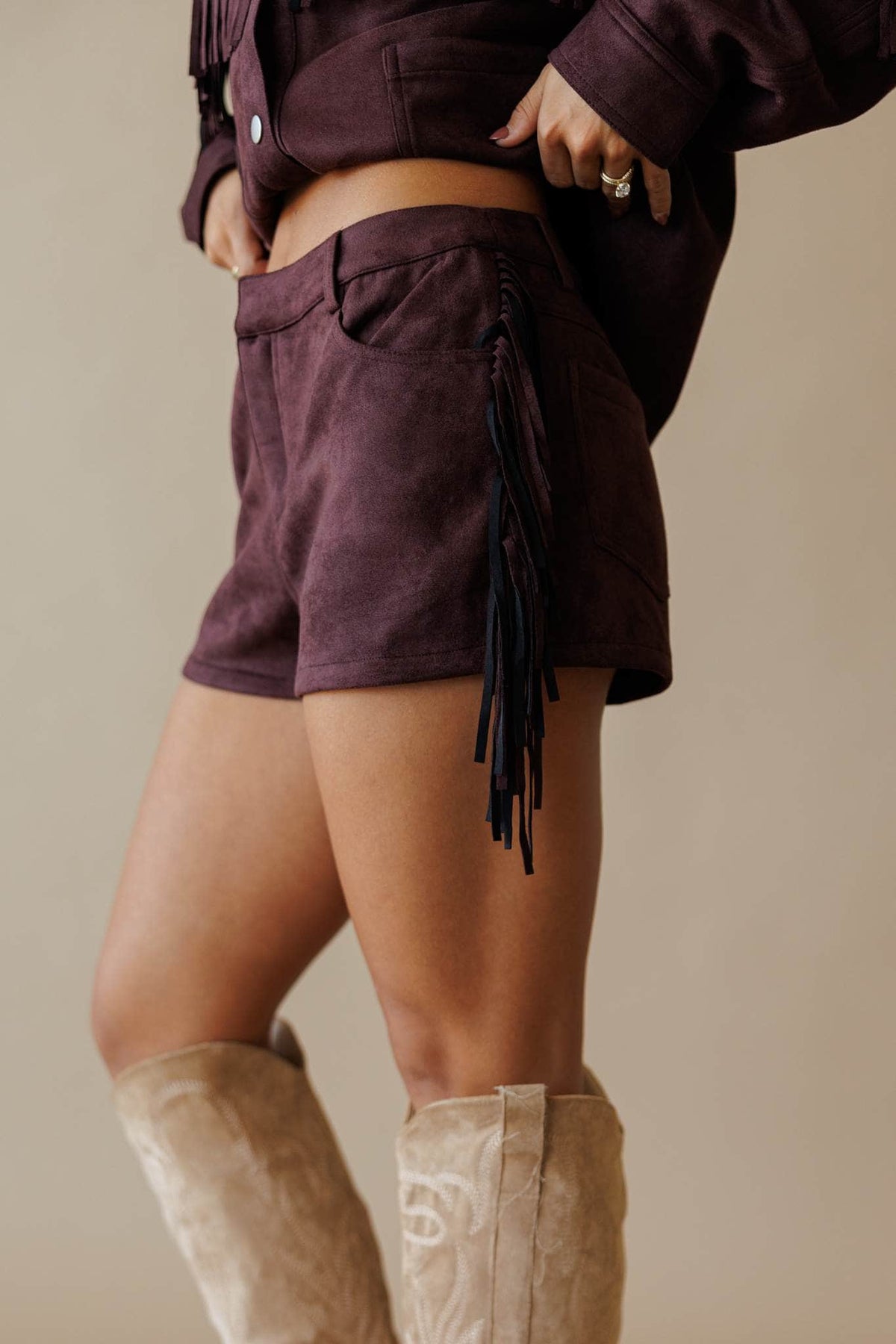 Dark brown suede shorts with fringe