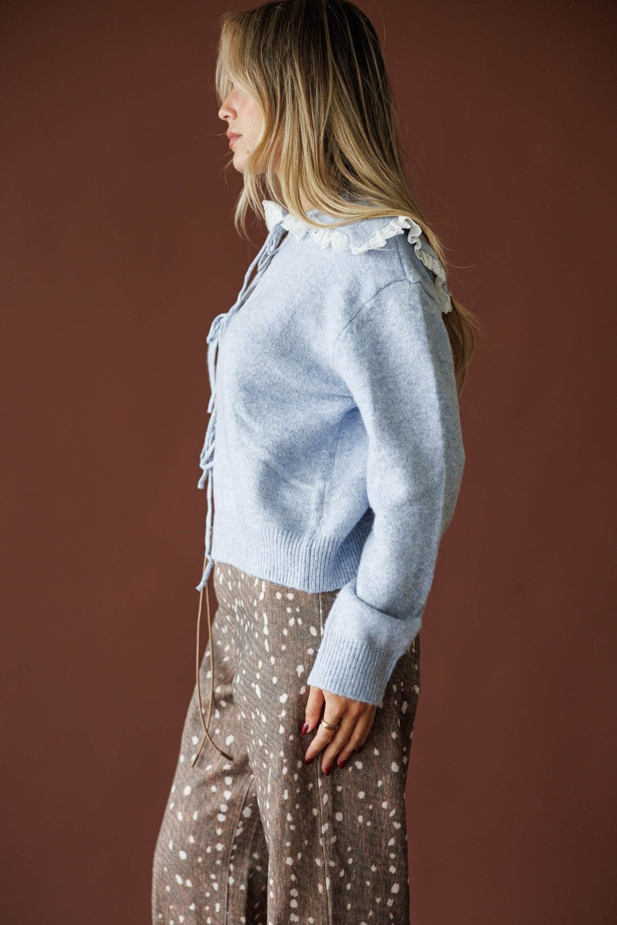 Sweet Collar Knit Cardigan in blue, side view showing the powder blue knit cardigan