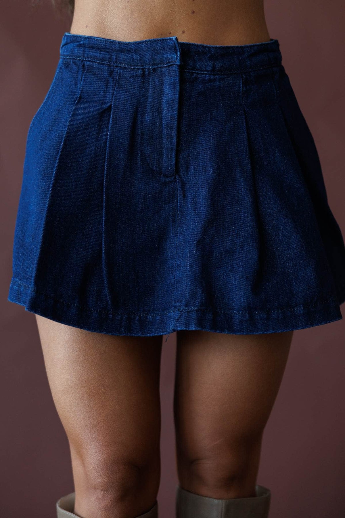 Dark denim pleated skort, front view