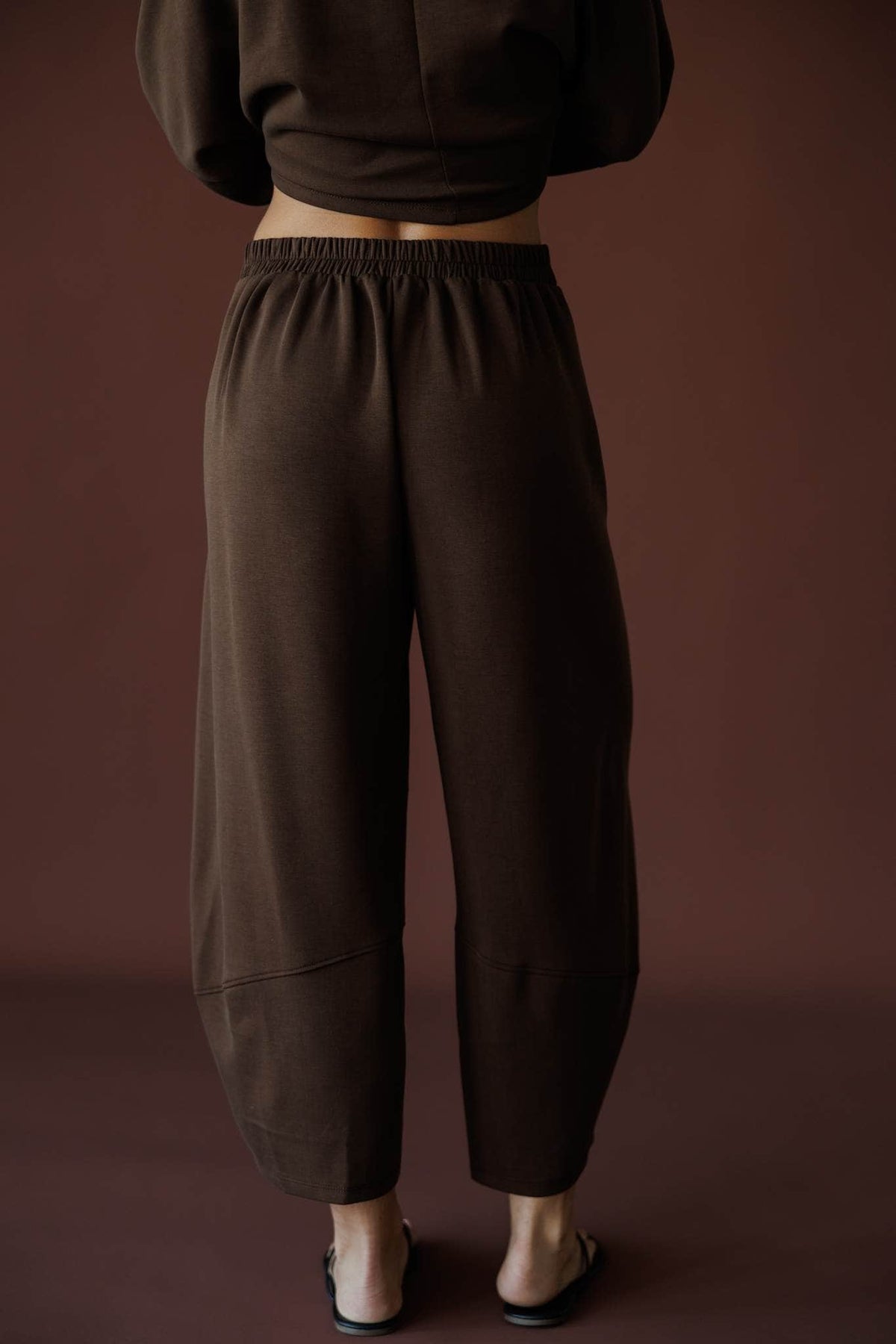 Scuba Barrel Sweatpants in brown, back view close-up showing the barrel leg