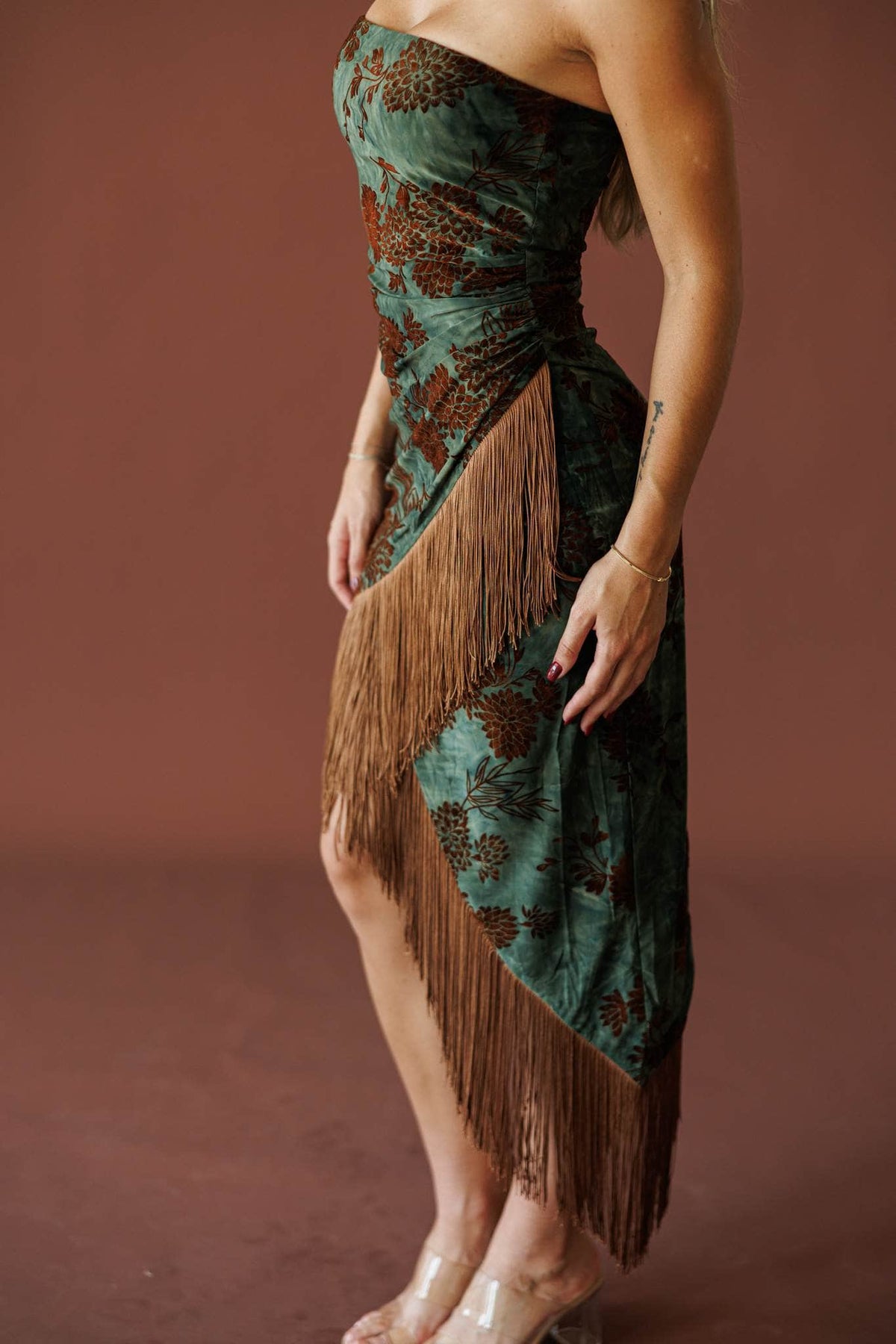 Shimmy All Night Dress in green floral, side view showing the fringe hem